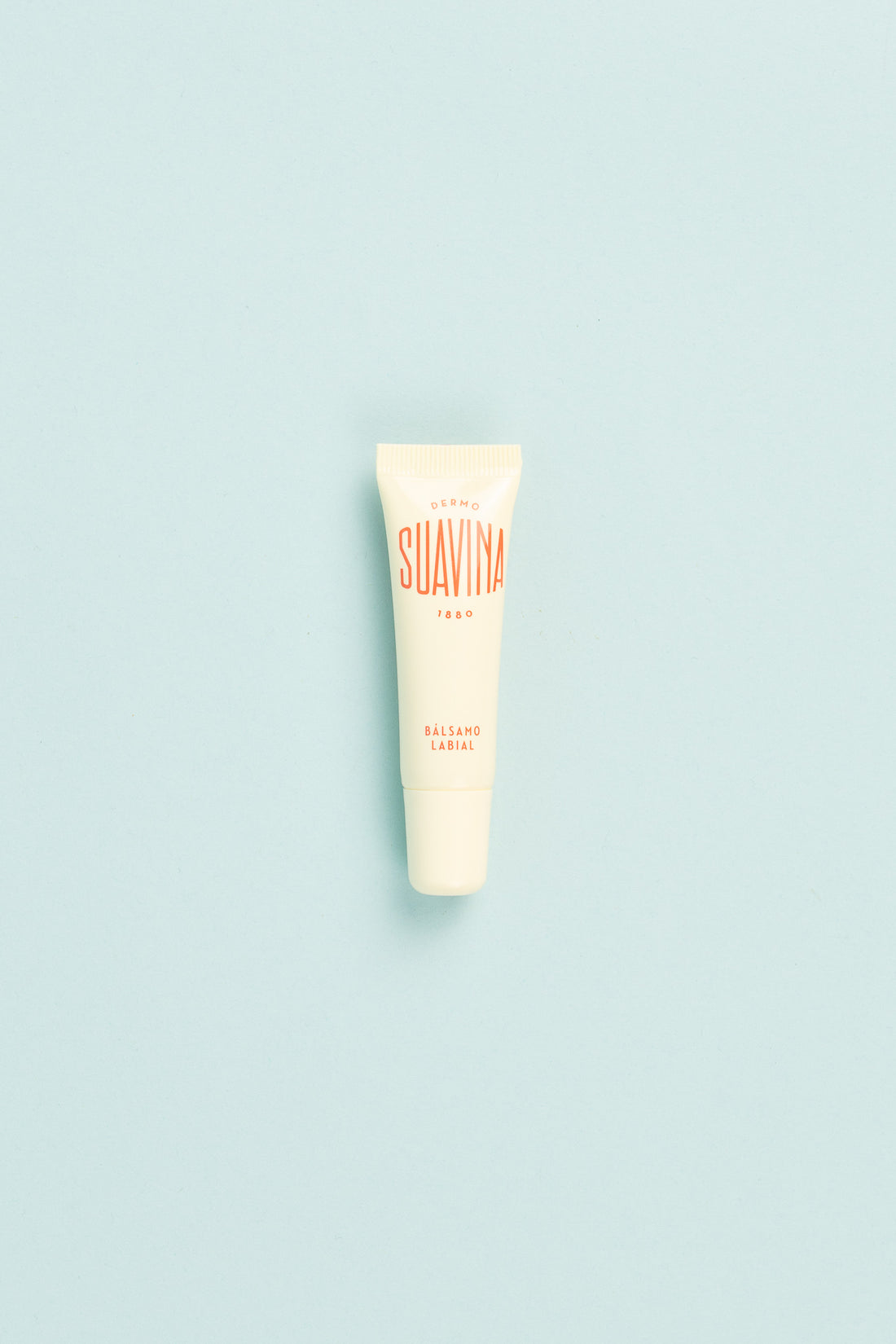 Original Lip Balm in 10ml tube packaging on light blue background for dry and cracked lips care.