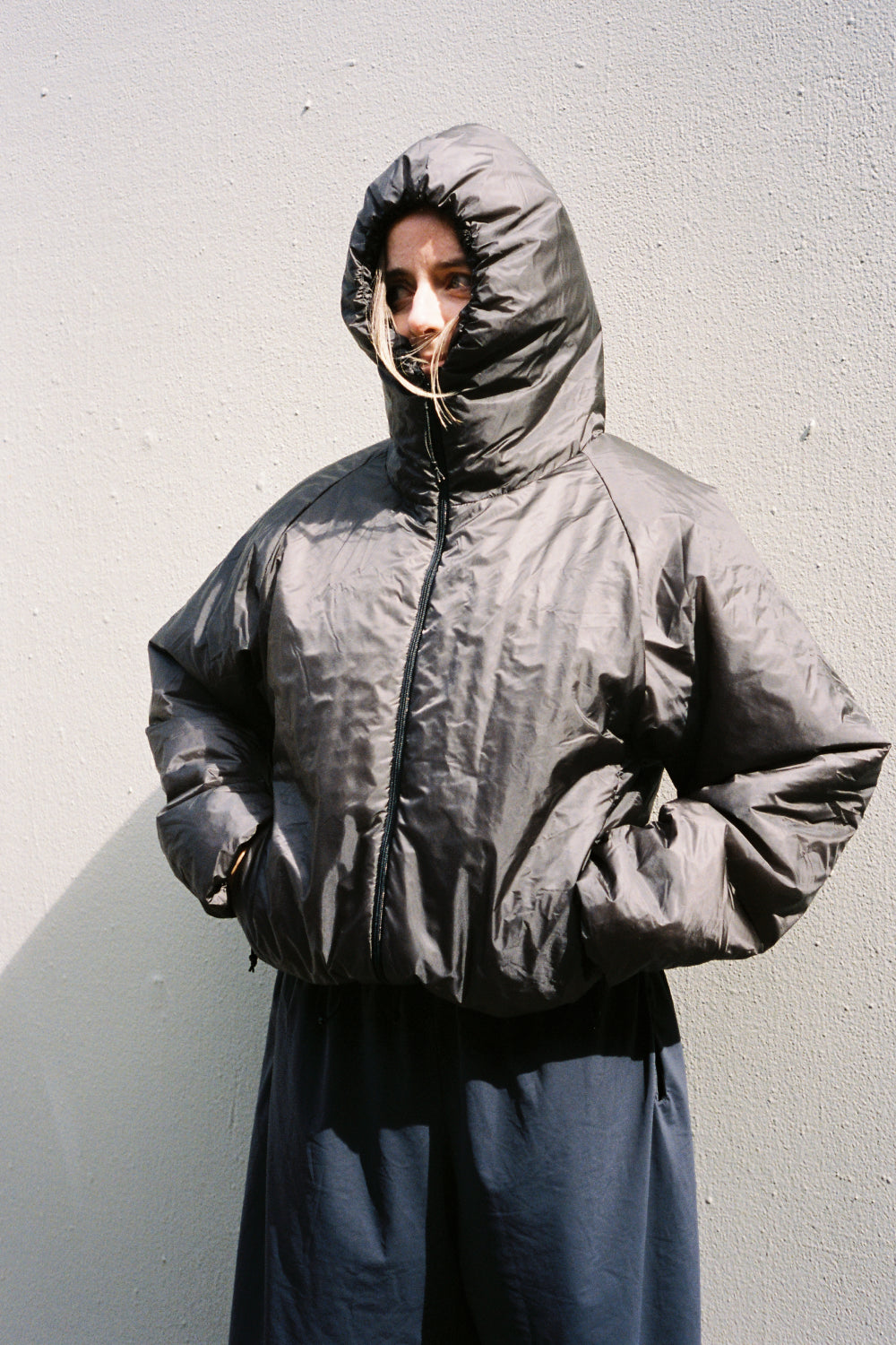 Model wearing the Heatwave Puffer Jacket in Major Brown against a minimalist background.