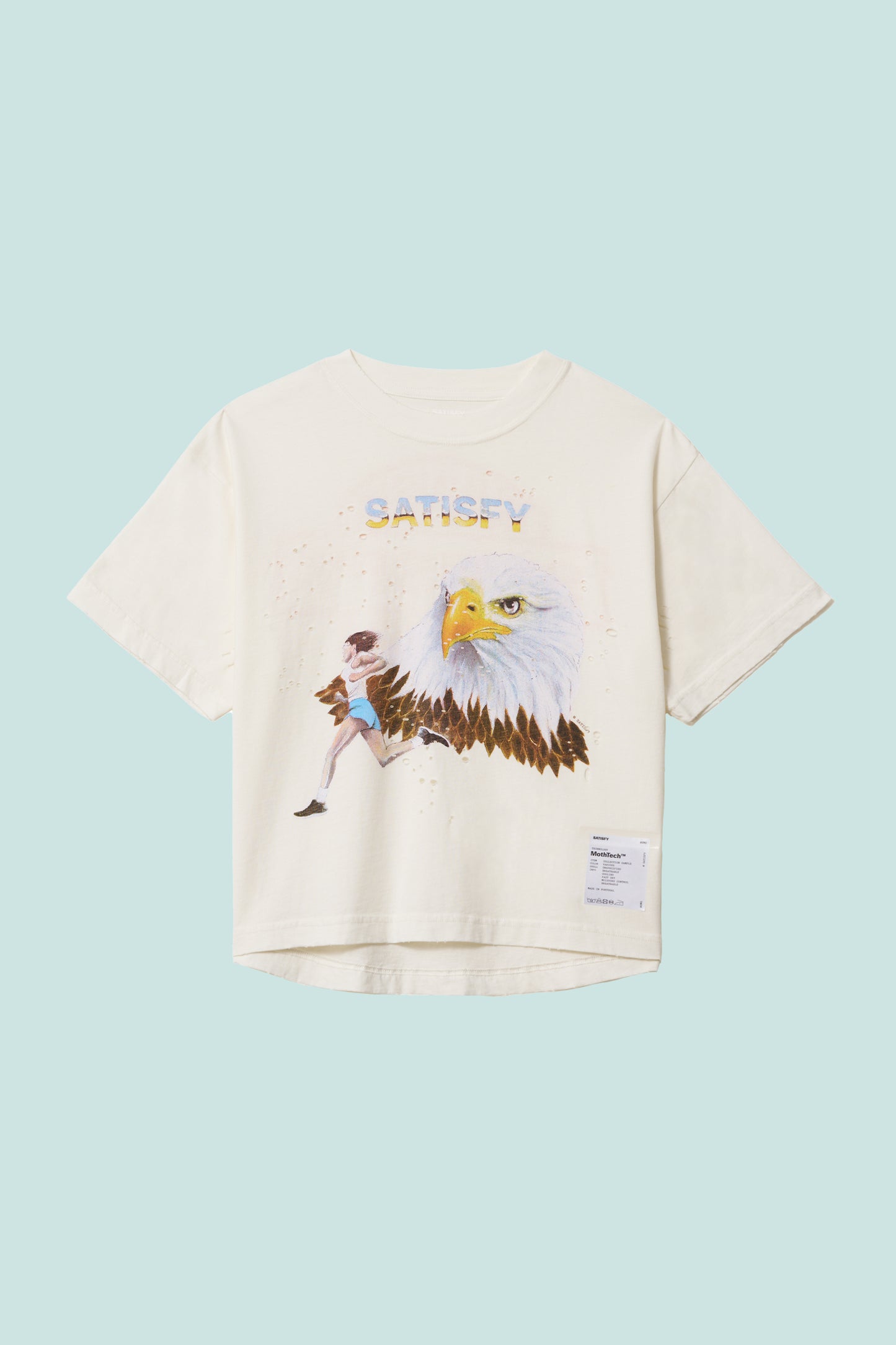 Satisfy Women's MothTech™ T-Shirt in off-white with eagle graphic and cotton fabric for comfortable running.
