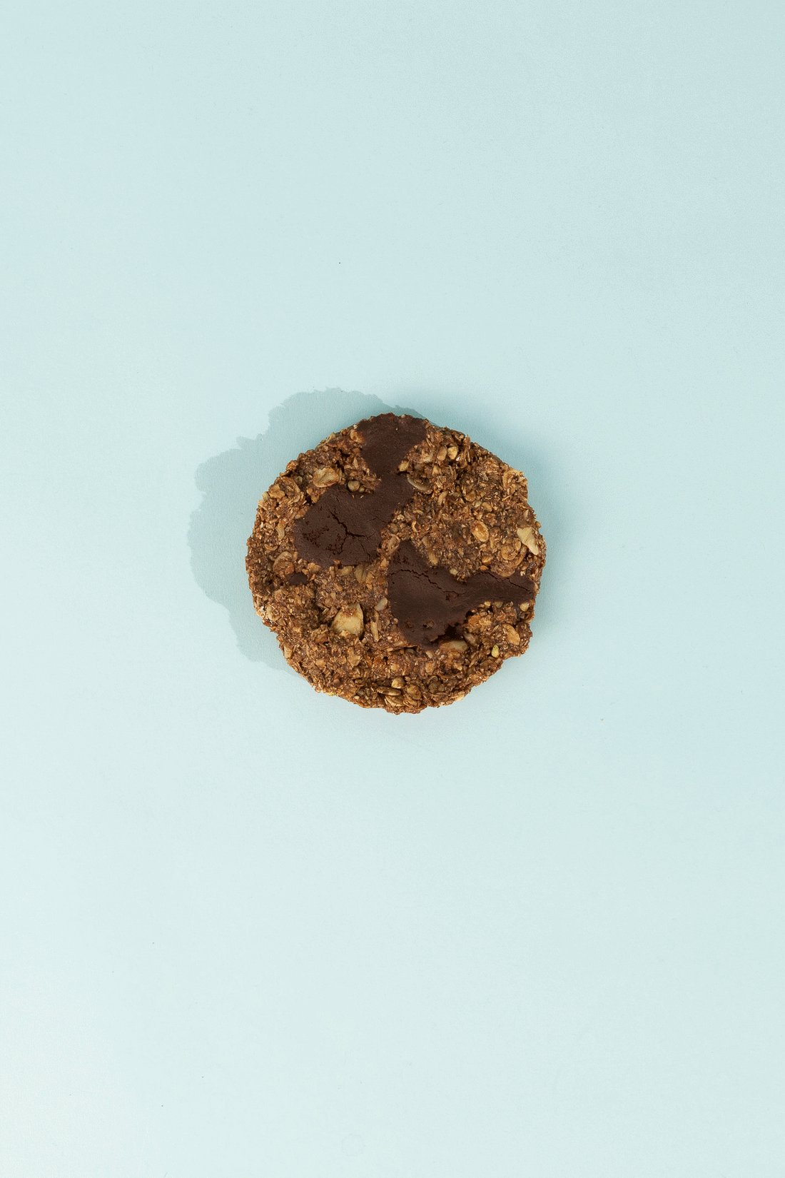 Good Cookie - Double Chocolate Chip on a light blue background, featuring chocolate chunks and oats.