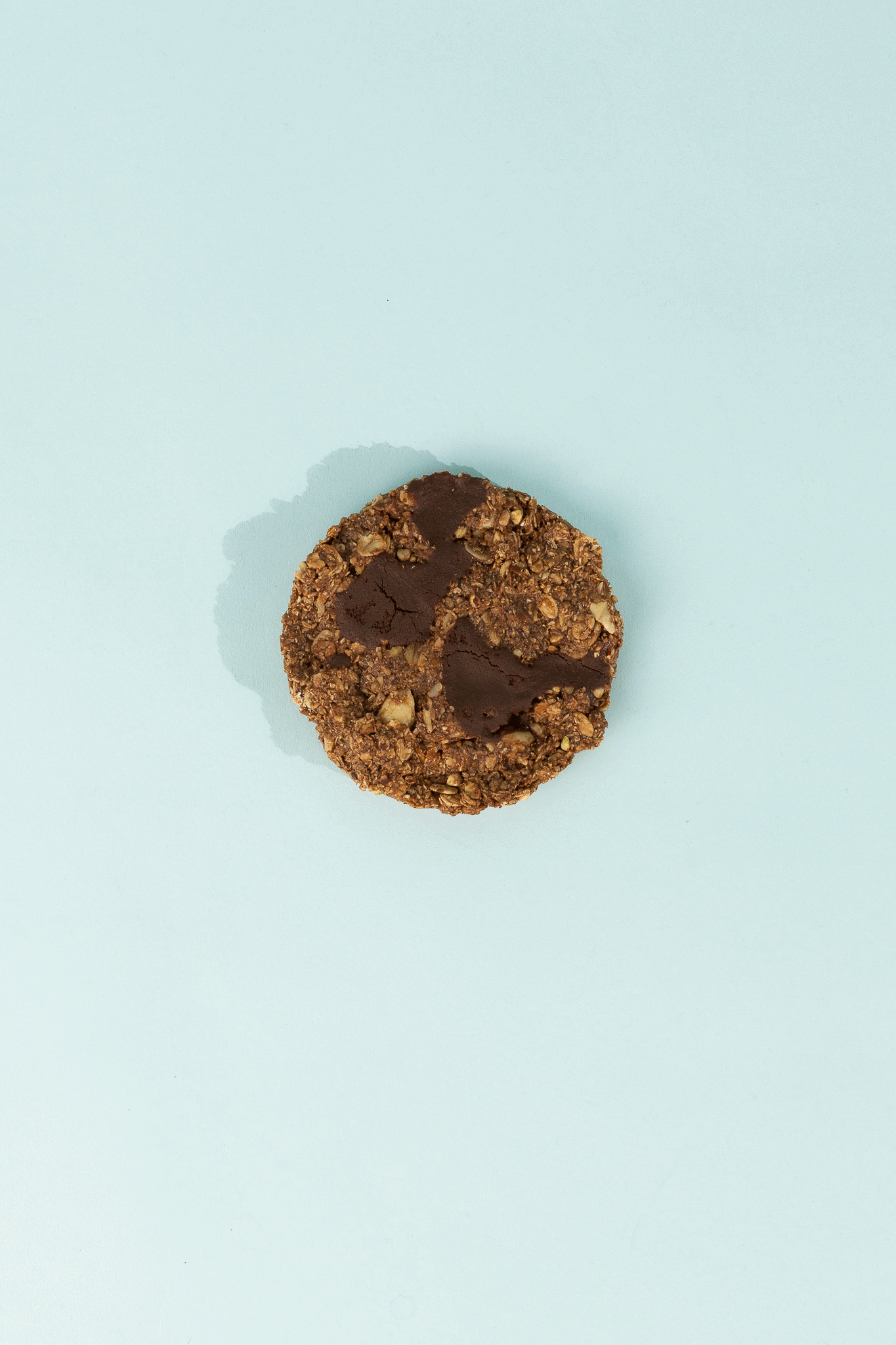 Good Cookie - Double Chocolate Chip on a light blue background, featuring chocolate chunks and oats.