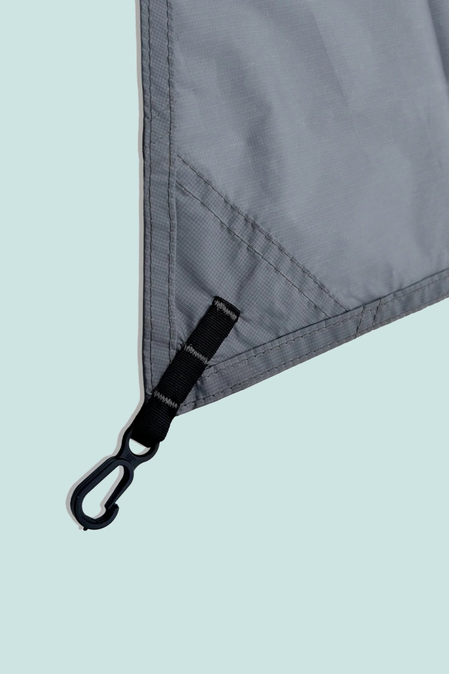 Close-up of Durston groundsheet corner with clip attachment in grey fabric for ultralight tents.