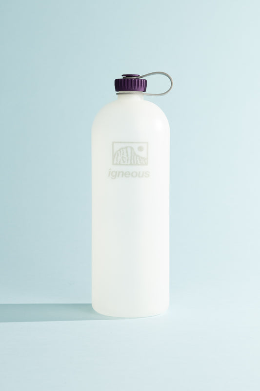 Igneous Gear NOBO Bottle in clear with purple cap, designed for ultralight hiking and daily use.