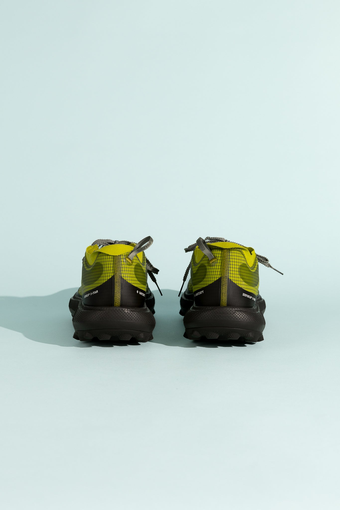 Satisfy TheROCKER shoes in Grenoble Green, showcasing the unique outsole and design from the back view.