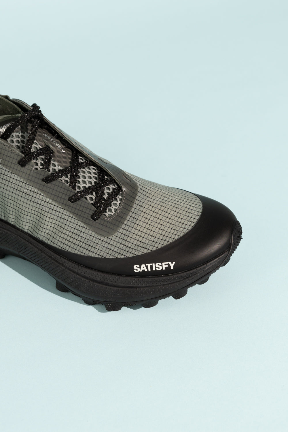 Satisfy TheROCKER - Shadow performance shoe designed for diverse terrains including concrete and mud.