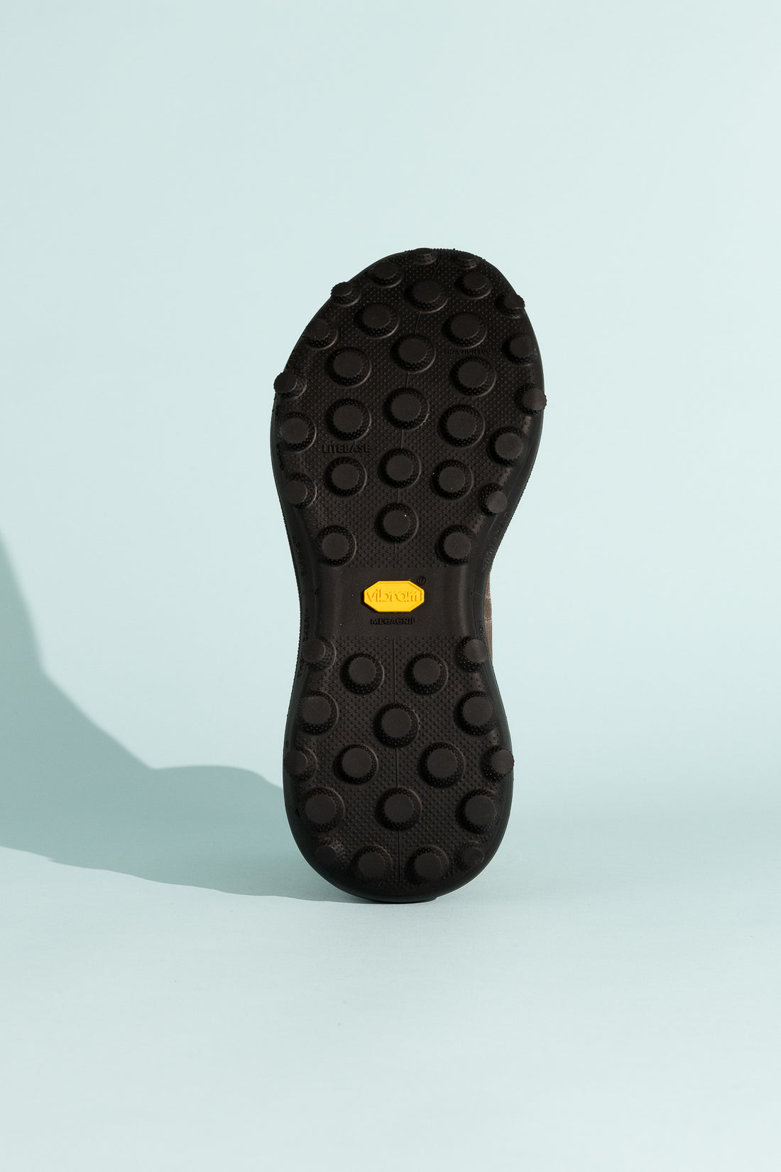 Satisfy TheROCKER shoe outsole showcasing TuneLug technology for traction on various terrains.