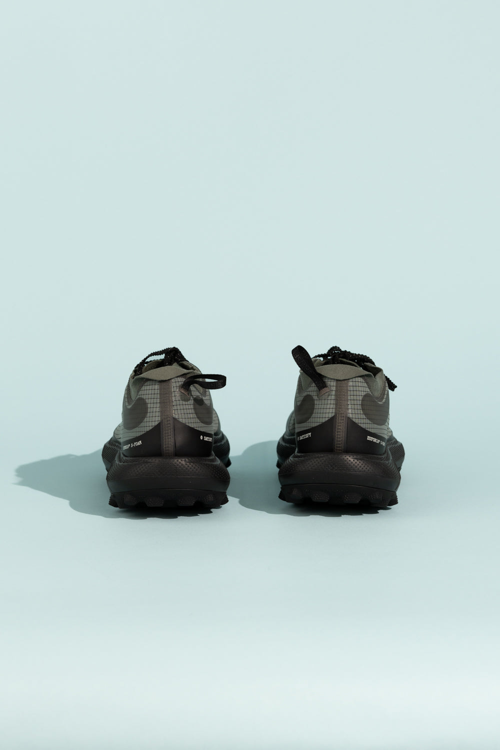 Satisfy TheROCKER - Shadow shoes showcasing the back view, designed for ultra distance performance on various terrains.