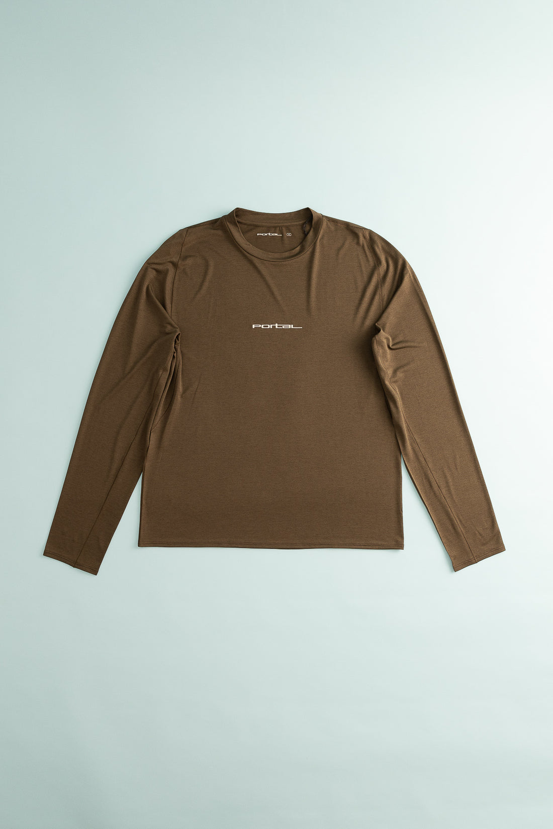 Lateral Peak Long Tee in brown, a technical active t-shirt designed for hiking and running.