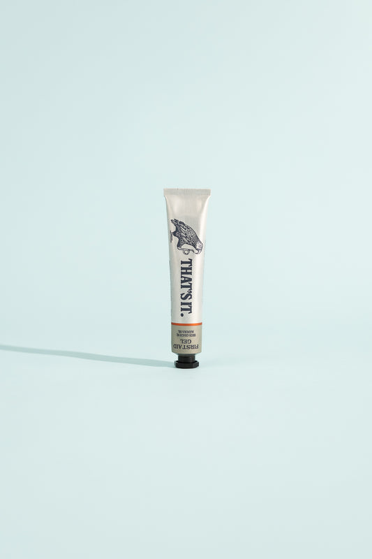 First Aid Gel - 25ml tube standing against a light blue background, essential for your first aid kit.