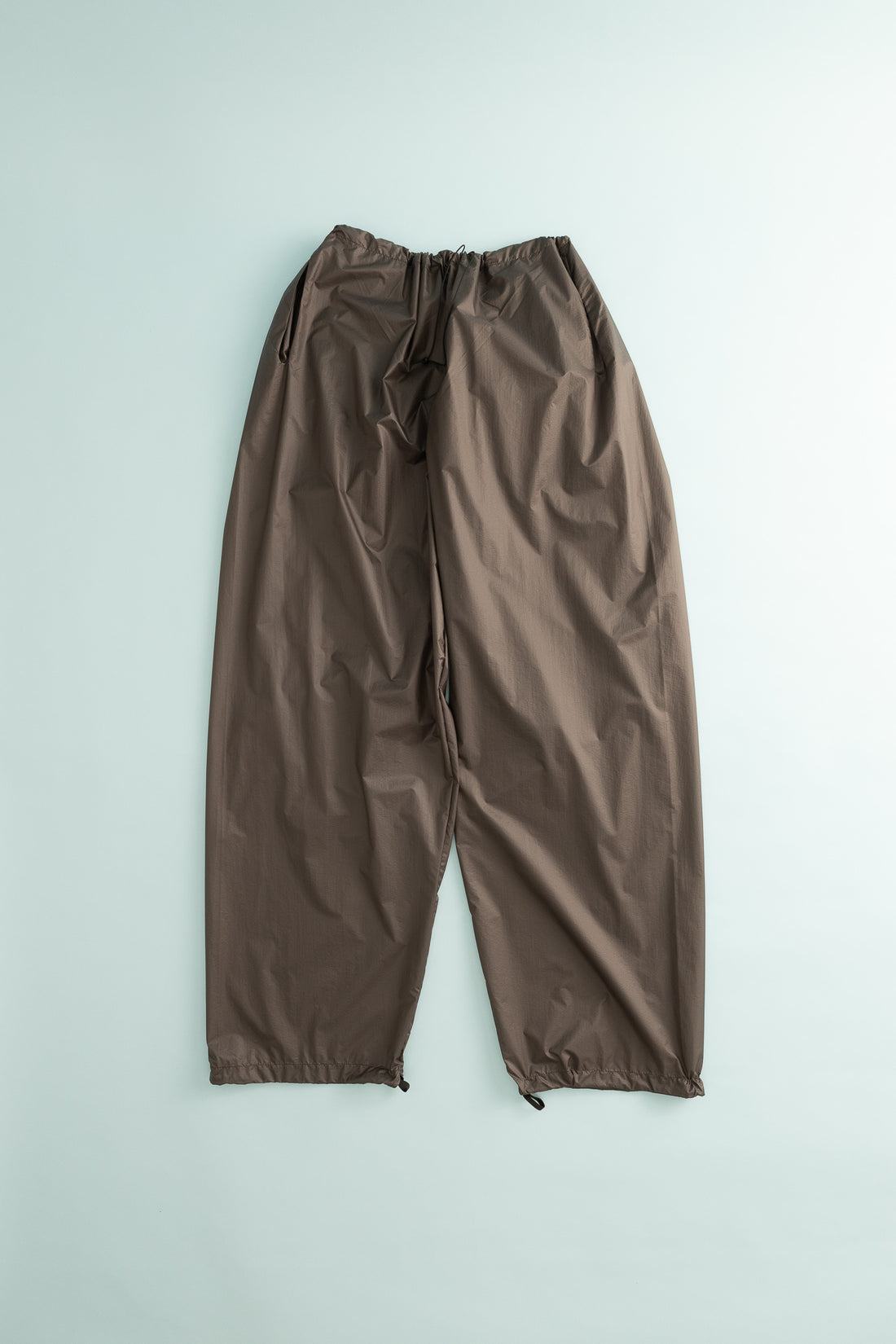 Gnuhr Breaker Wind Pant in Iron color, lightweight and packable for wind protection during outdoor activities.