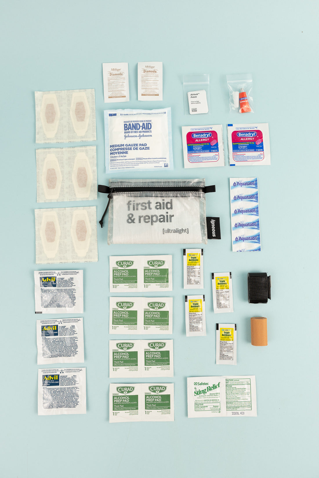 Image of Igneous First Aid + Repair Kit displaying various medical components for hiking and outdoor activities.
