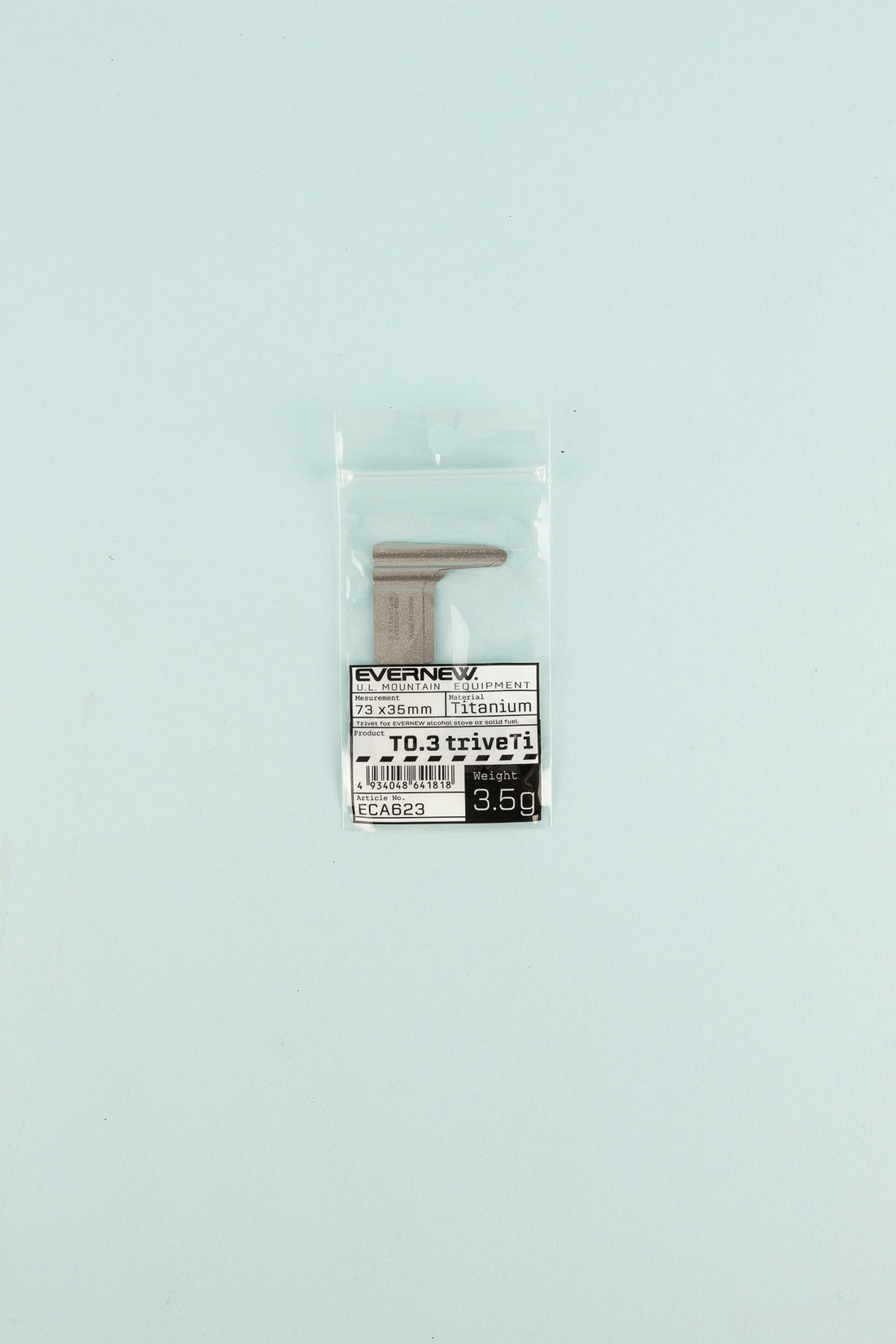 Evernew T0.3 TriveTi titanium accessory in packaging on light blue background.