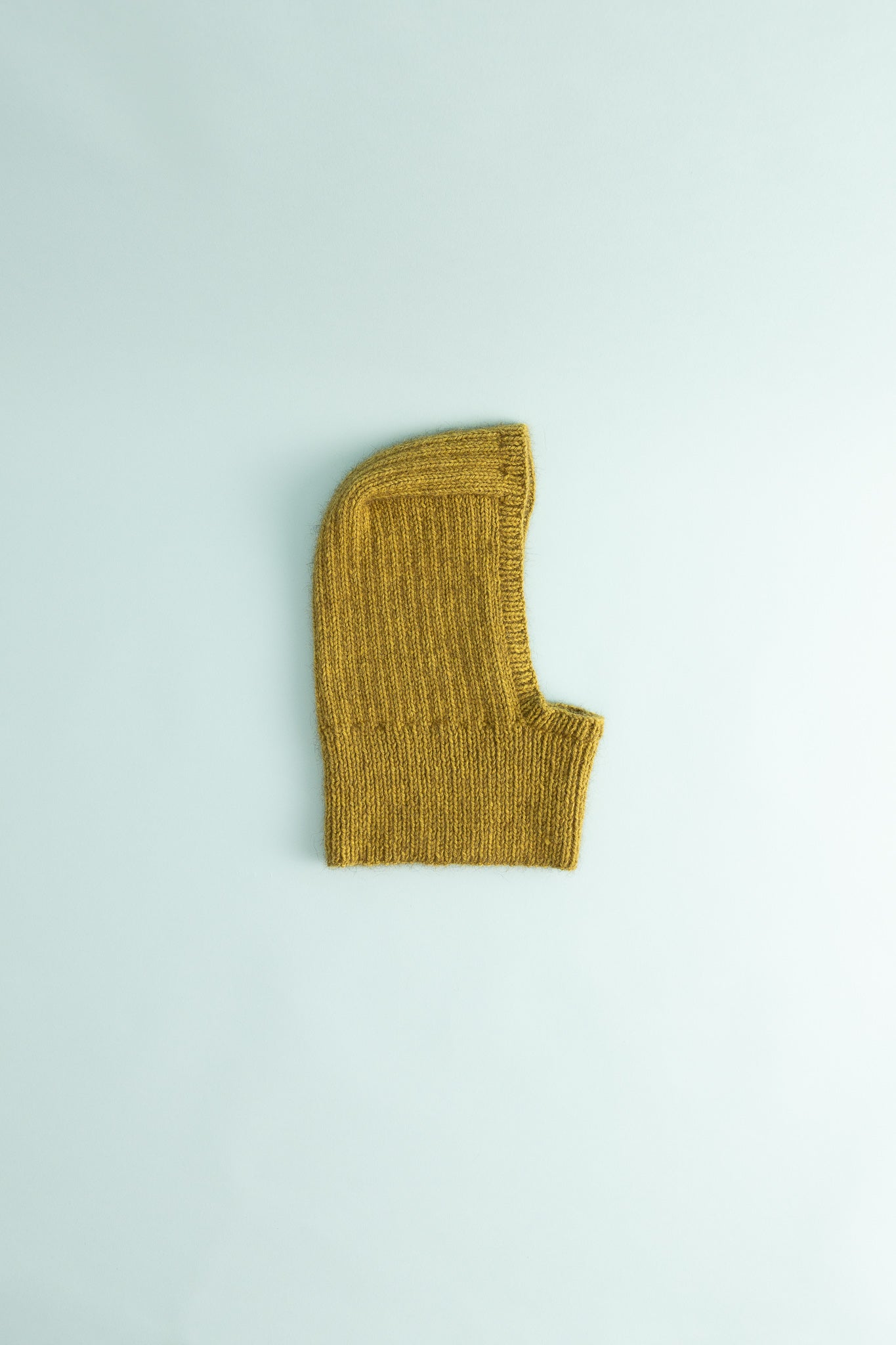 Balaclava in chartreuse color with rib knit design, perfect for warmth and comfort during colder weather.