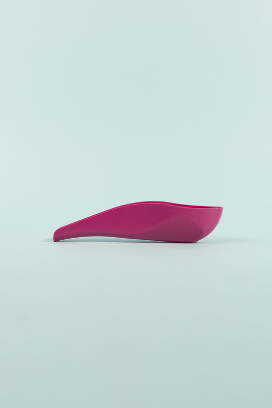 pStyle - Fuchsia plastic device for women and non-binary folks to pee standing up comfortably.