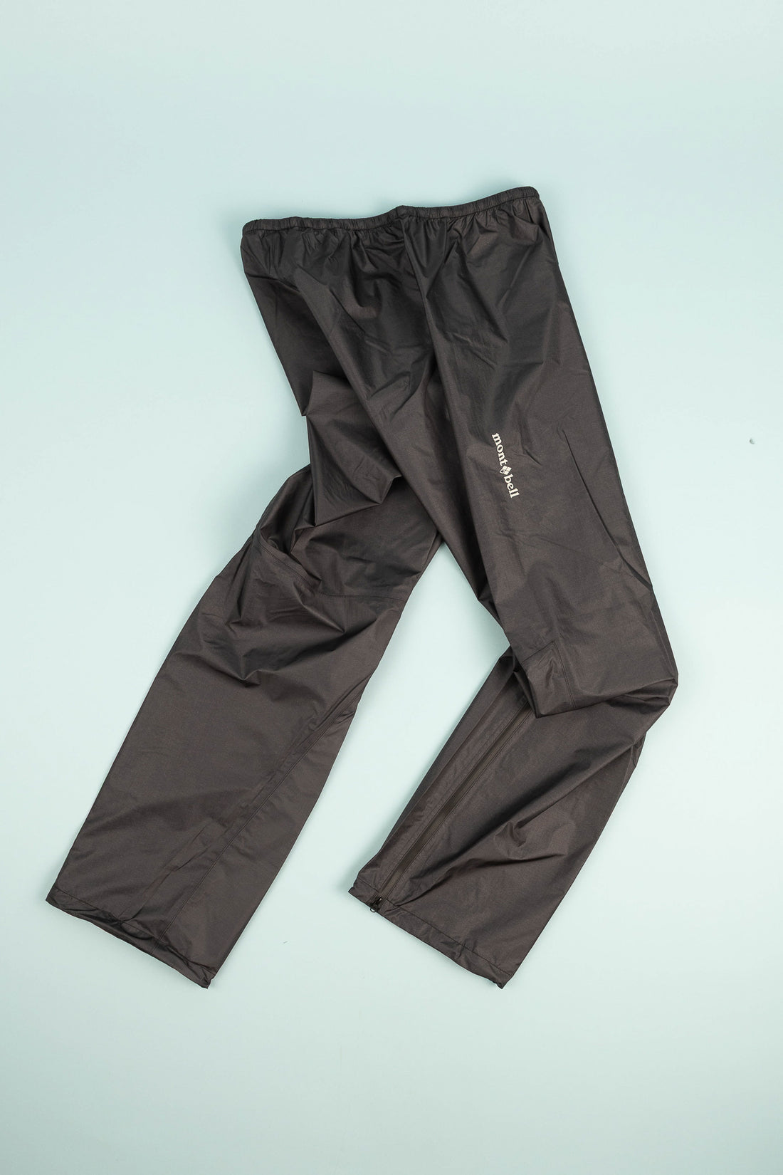 Montbell US Men's Dry-Tec U.L. Rain Pants in black, showcasing lightweight and waterproof ultralight design.