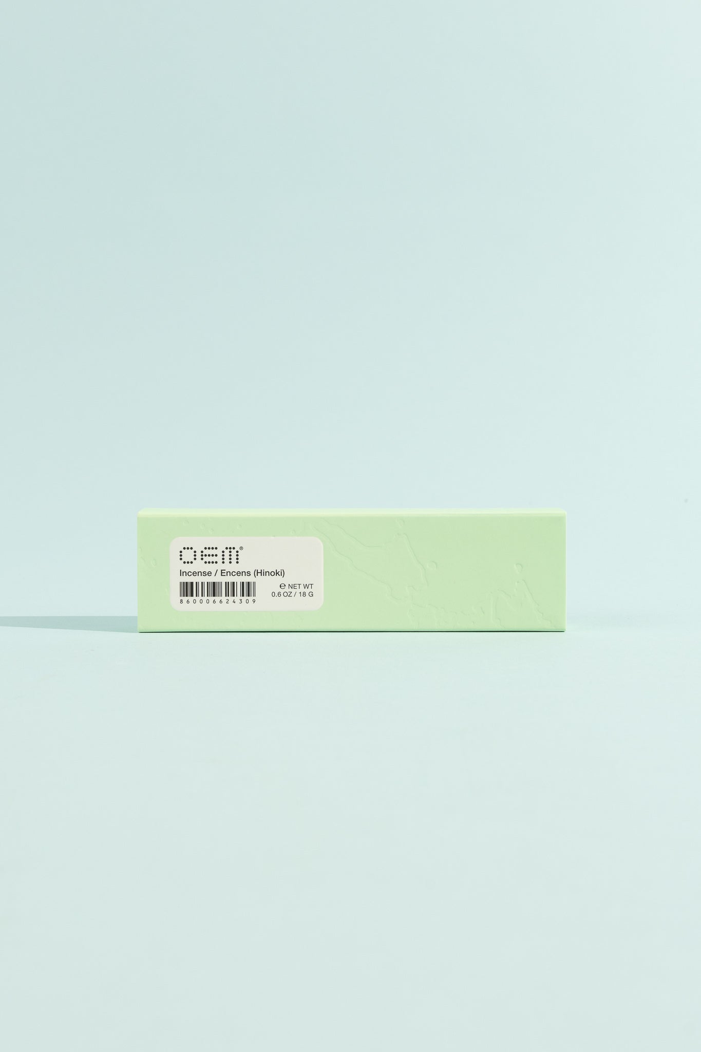 OEM Incense 50 Pack - Hinoki packaging in soft green color against a light blue background.