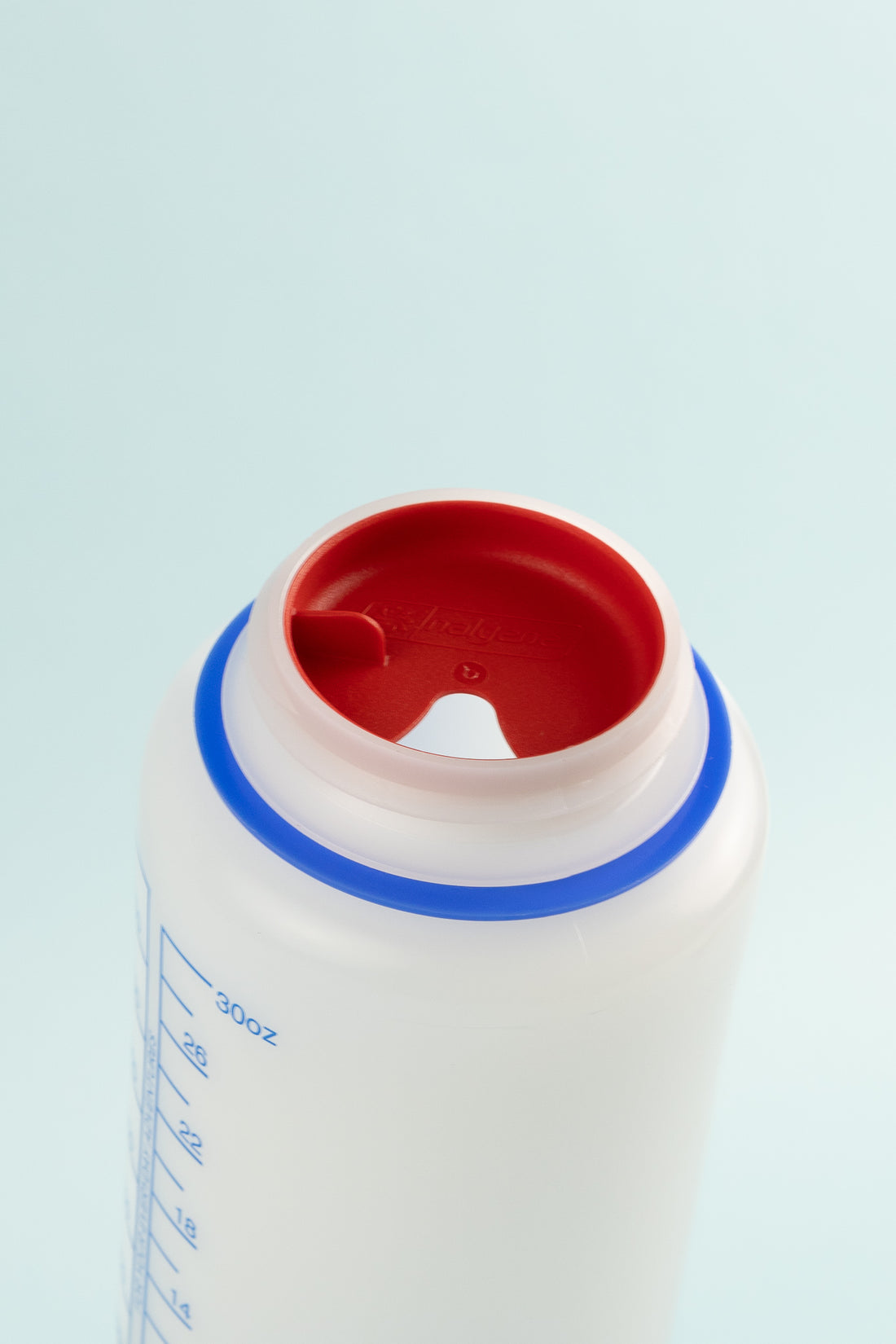 Top view of Easy Sipper - Red attached to Nalgene 1L Wide Mouth Bottle for easy sipping.