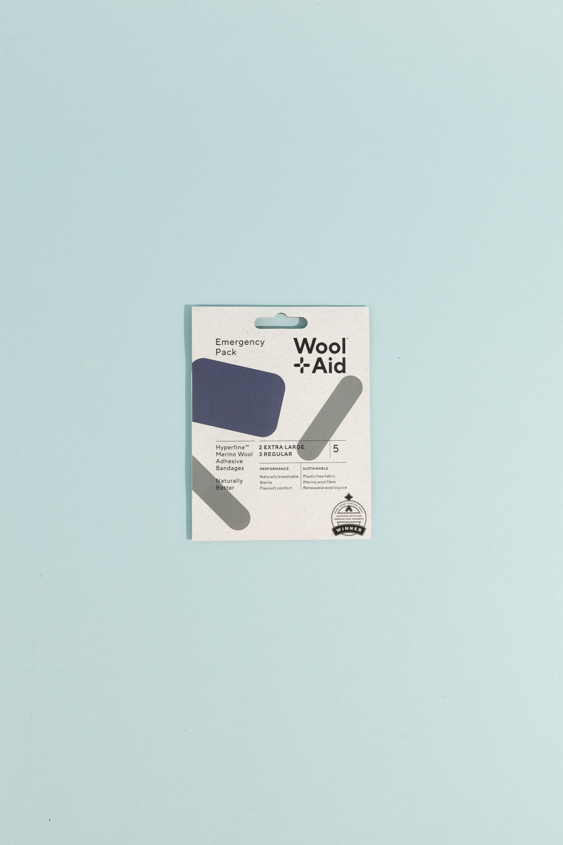 Merino Wool Adhesive Bandages Emergency Pack packaging displayed on a light blue background.