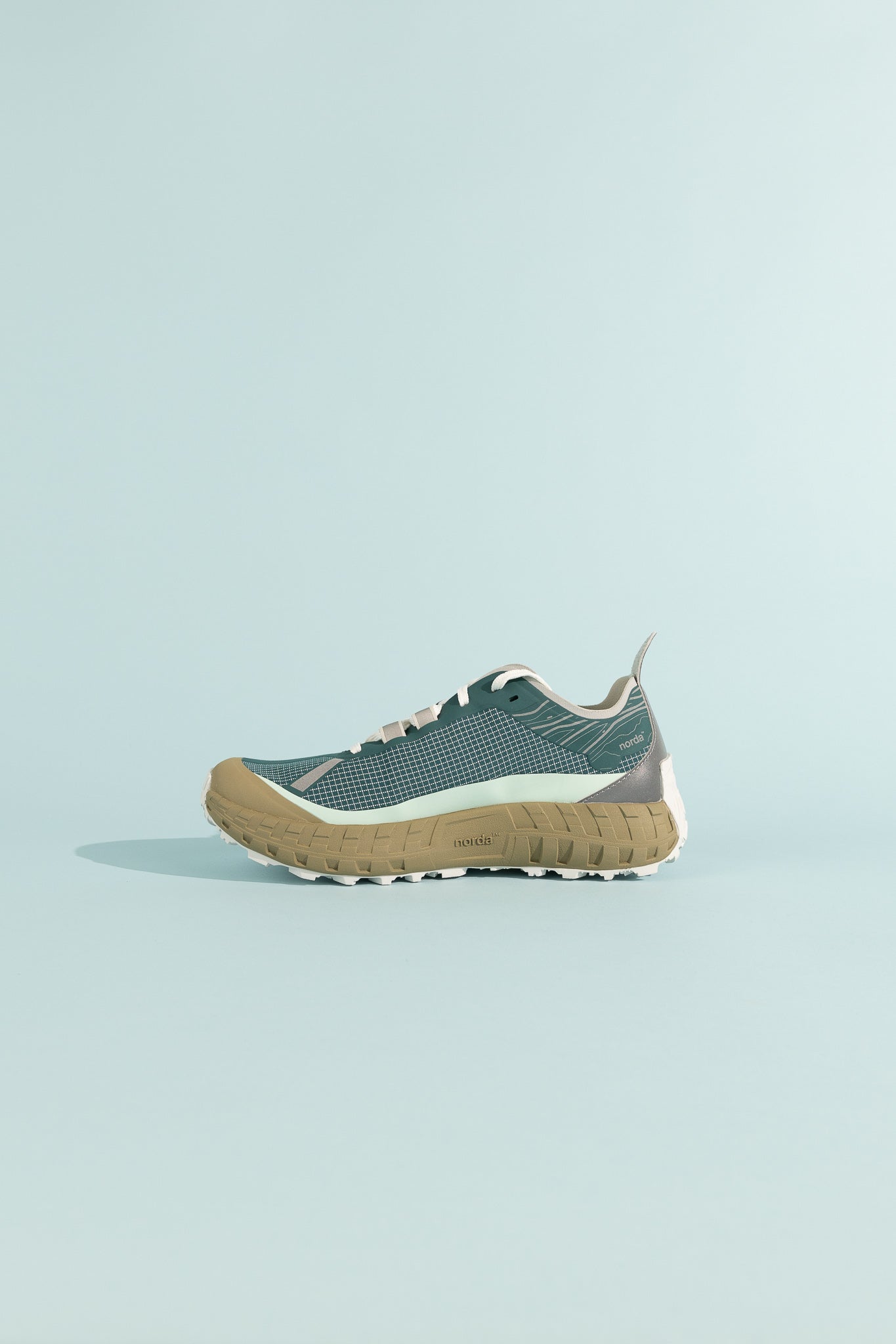 001A - Horizon shoe in teal and tan, featuring advanced midsole technology for superior comfort.