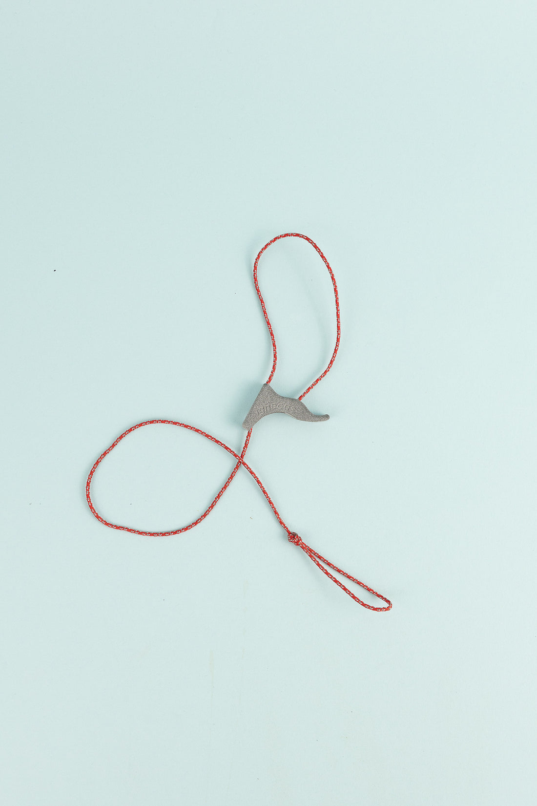 Gravity Filter Hang System featuring a reflective nylon cord and proprietary cleat for easy suspension.