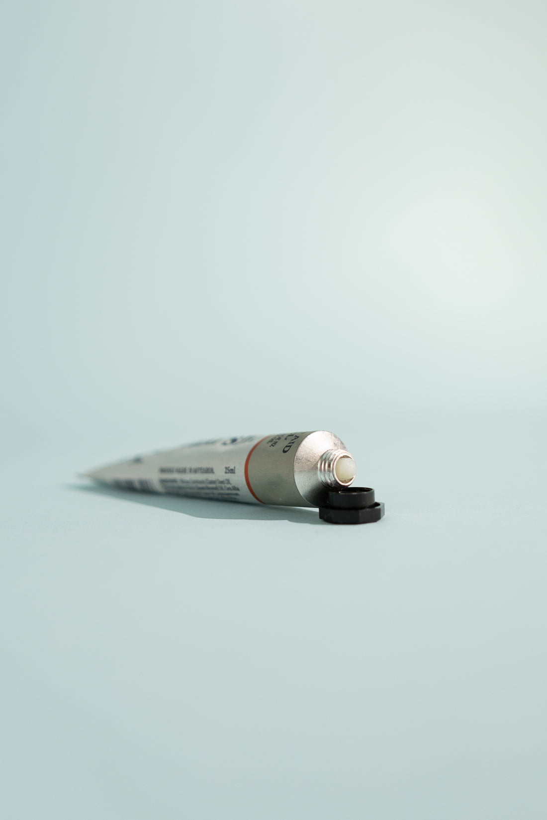 First Aid Gel - 25ml tube with black cap on a light blue background