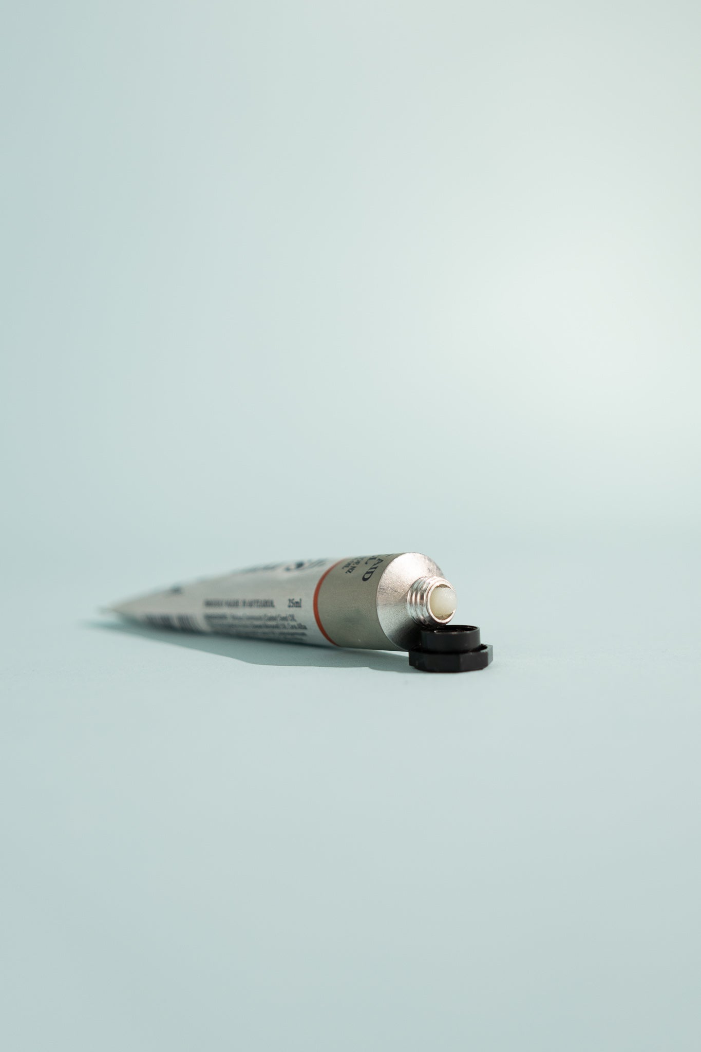 First Aid Gel - 25ml tube with black cap on a light blue background