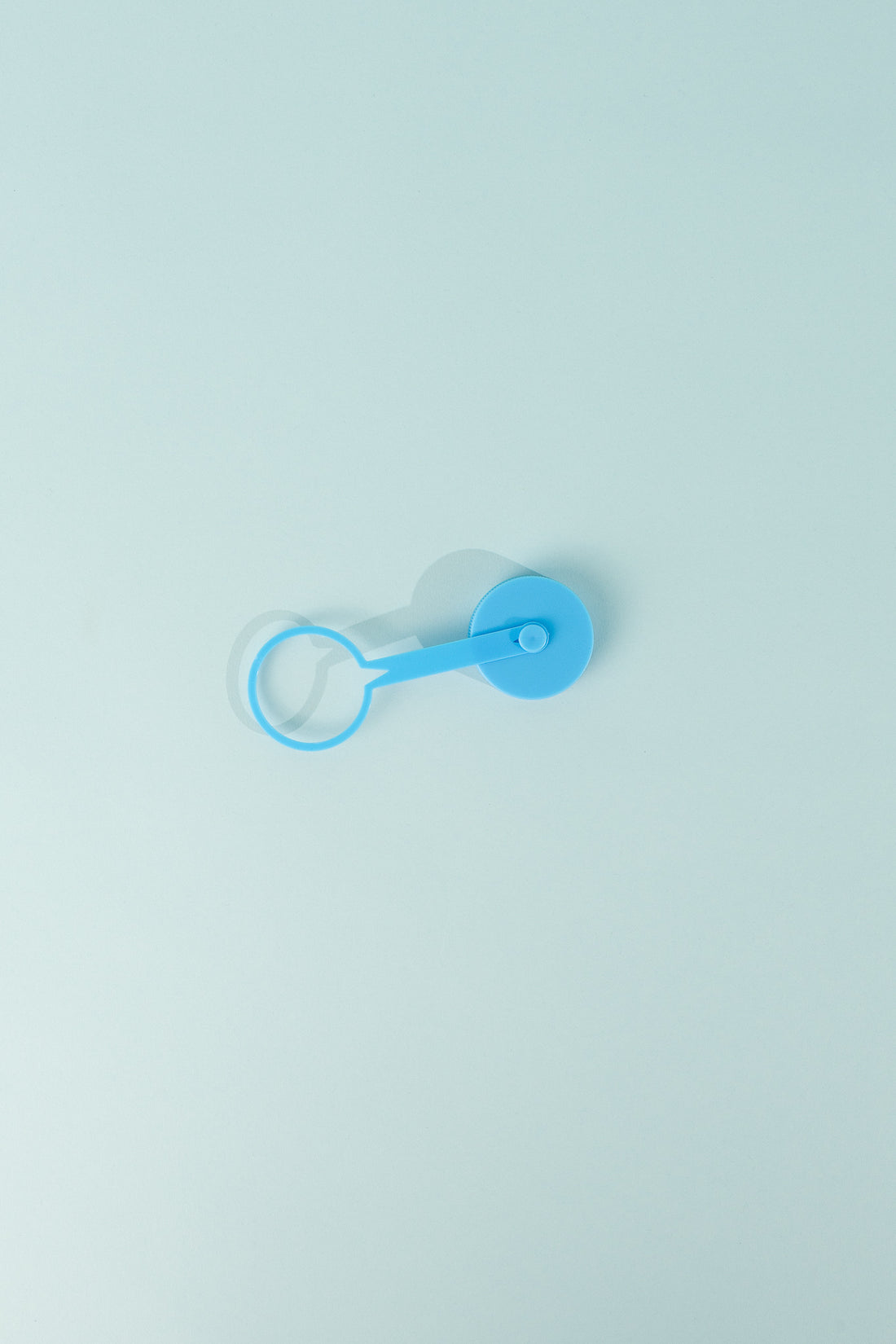Replacement Tethered Cap 42mm Thread in blue color resting on a light background.