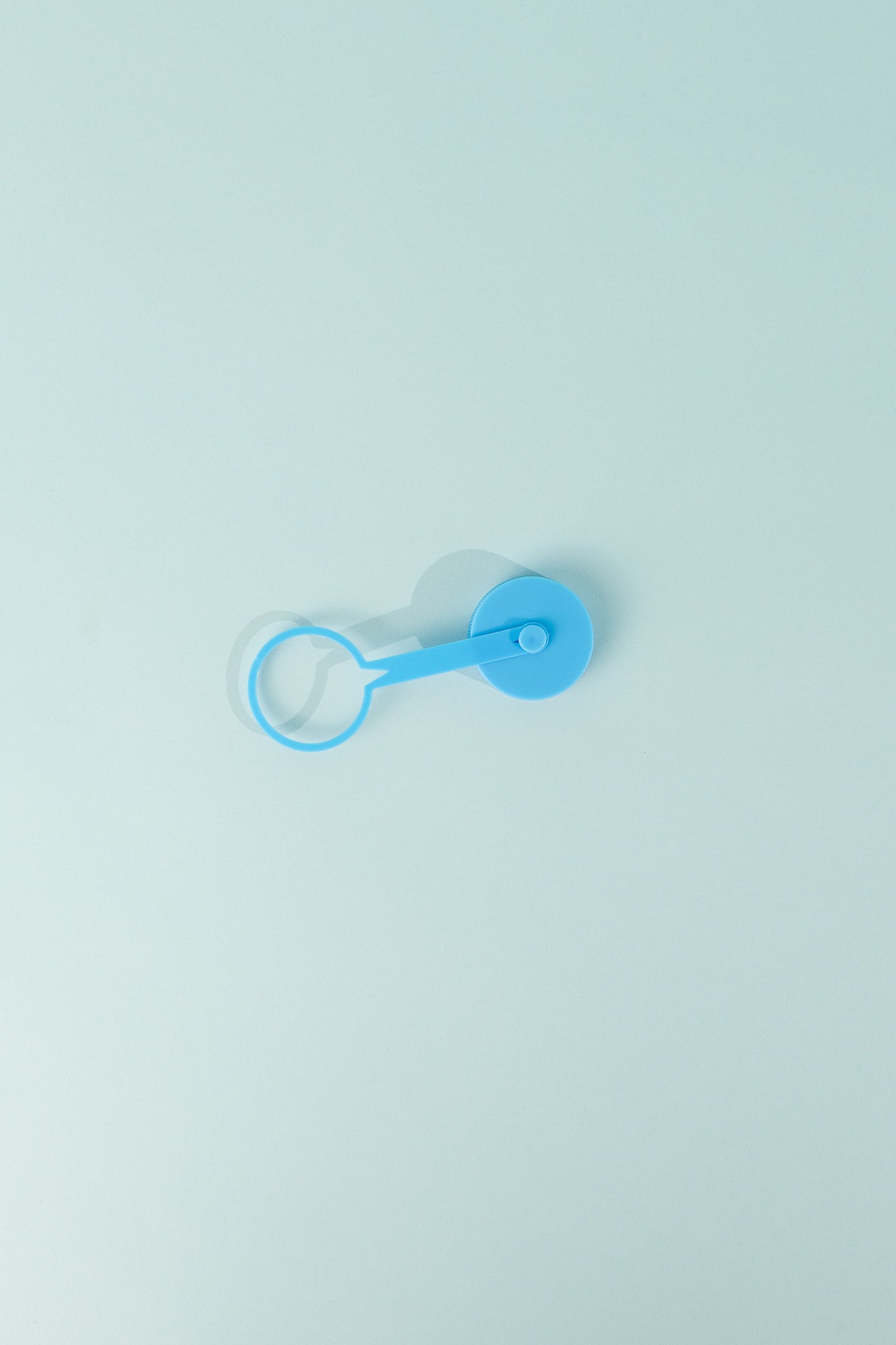 Replacement Tethered Cap 42mm Thread in blue color resting on a light background.