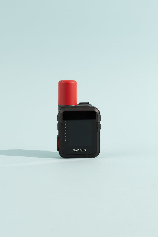 Garmin inReach® Mini 3 Plus device with red antenna against a light blue background, showcasing screen and design.