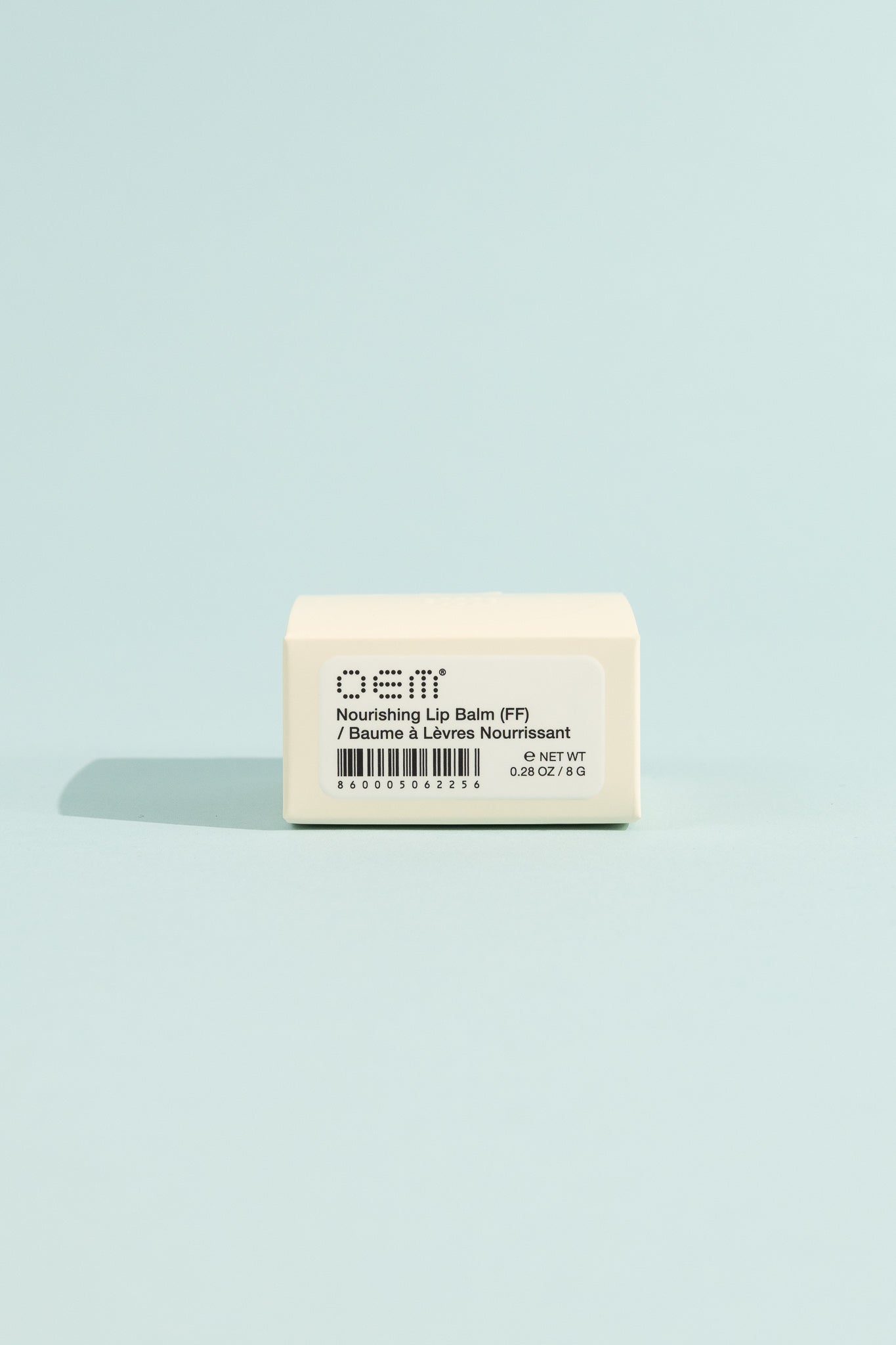 OEM Nourishing Lip Balm - Fragrance Free packaging on a blue background.