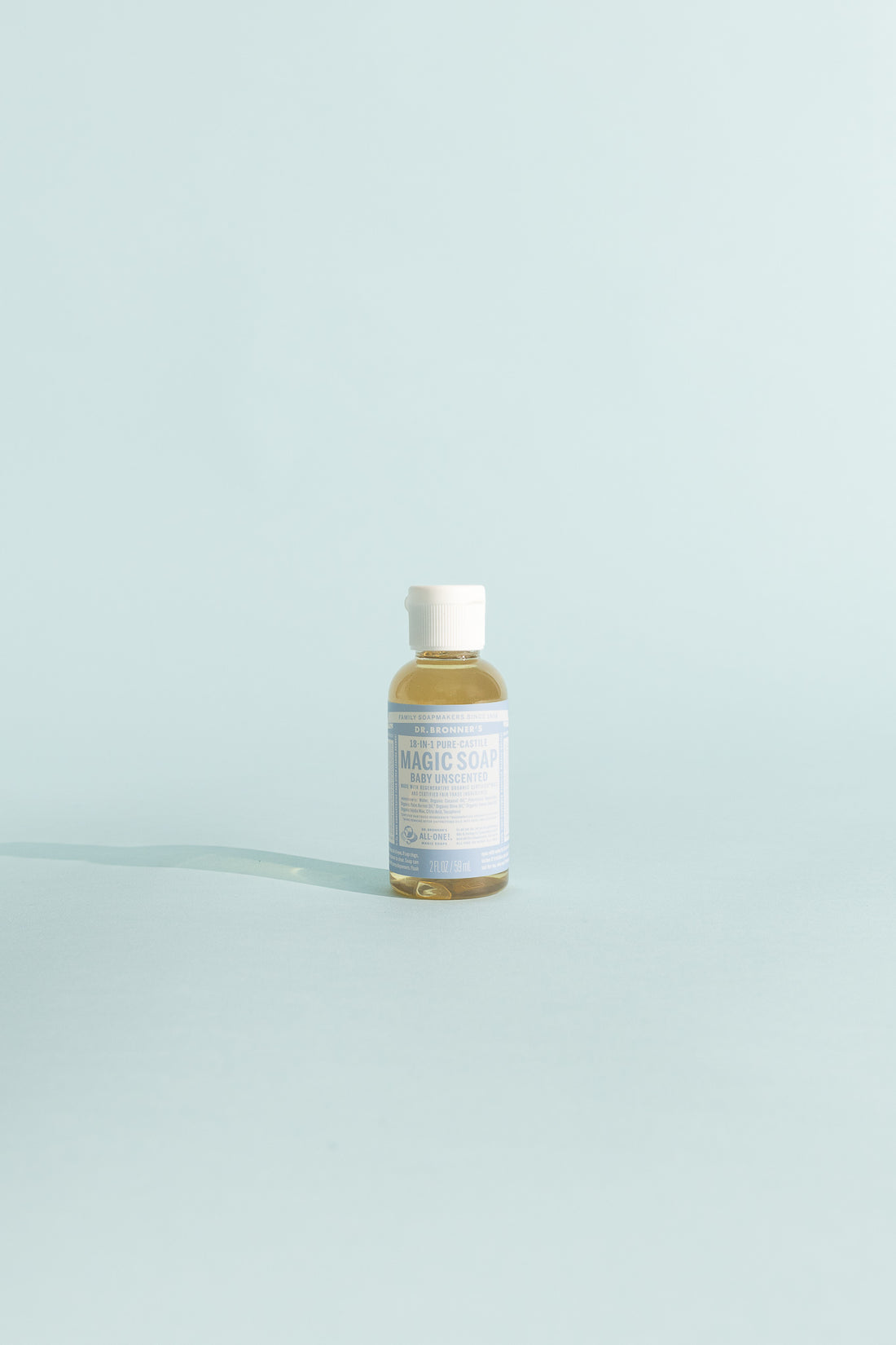 Unscented Pure-Castile Liquid Soap - 59ml bottle on a light blue background.