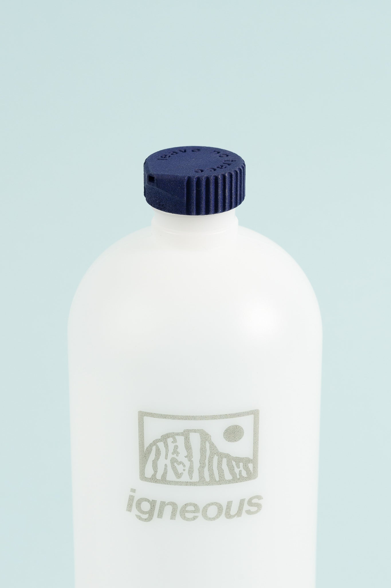 Igneous Gear Bottle Cap Bidet - Azurite attached to a water bottle for hygienic use in outdoor activities.