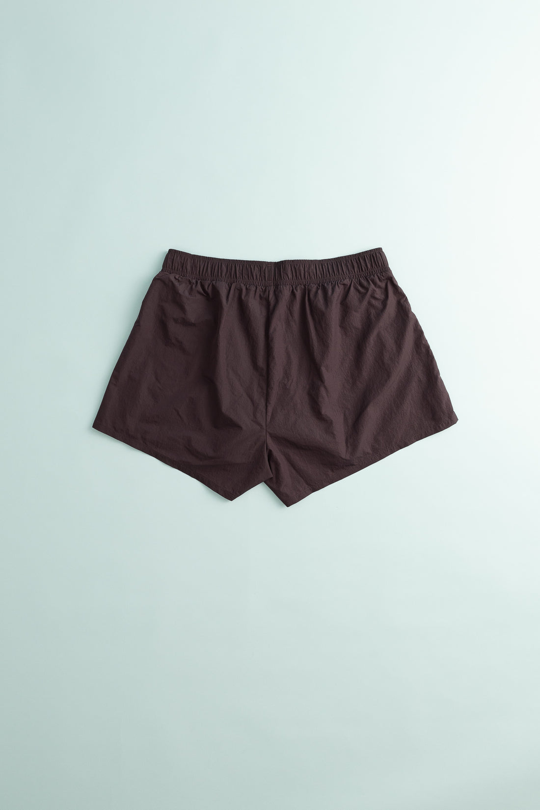 District Vision Women's Ultralight Nylon Zippered Shorts in Nightshade color, showcasing a lightweight and airy design.