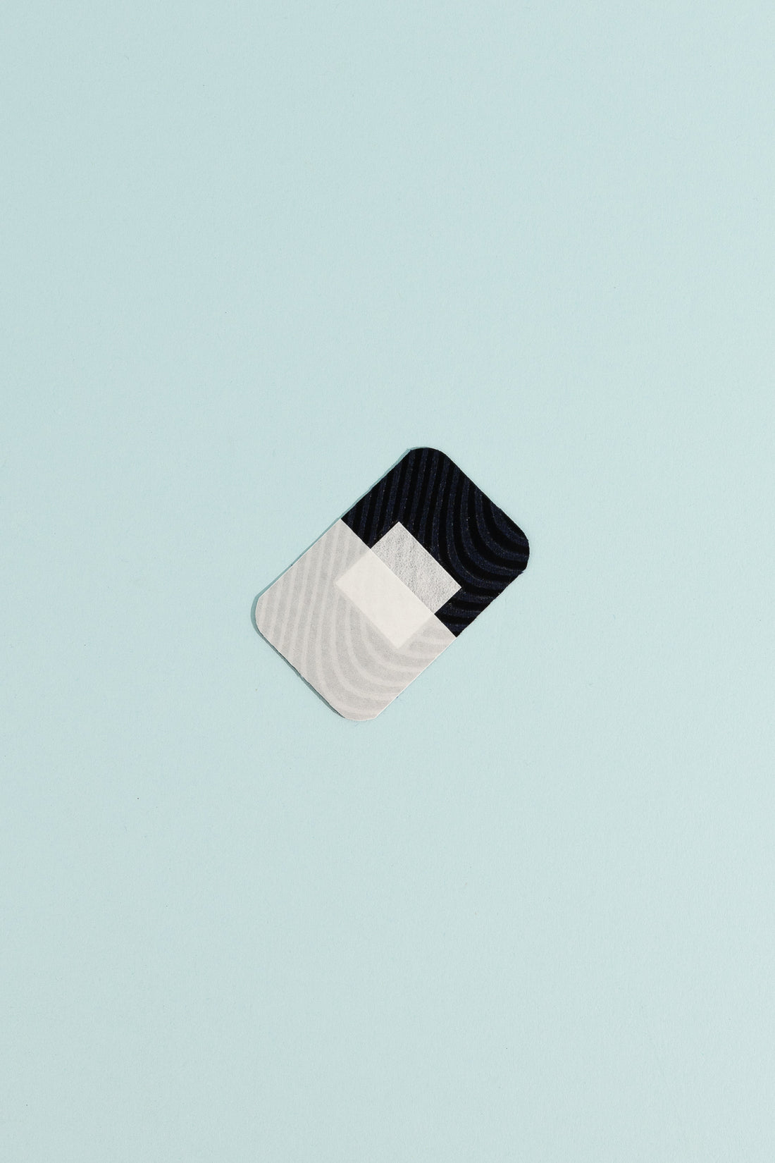 Merino Wool Adhesive Bandages on a light blue background, showcasing gentle and biodegradable first aid.