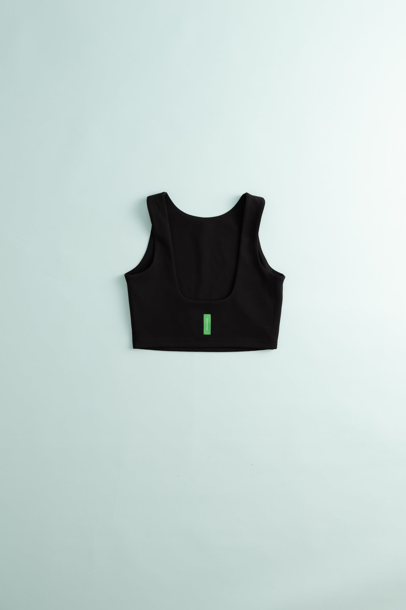 District Vision Womens High Neck Interlock Bra in black on a light background.