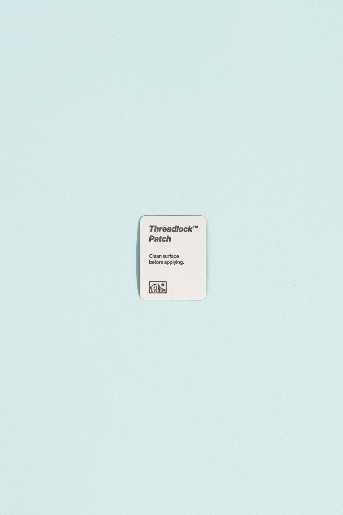 Threadlock Patch label on a blue background indicating clean surface before applying.