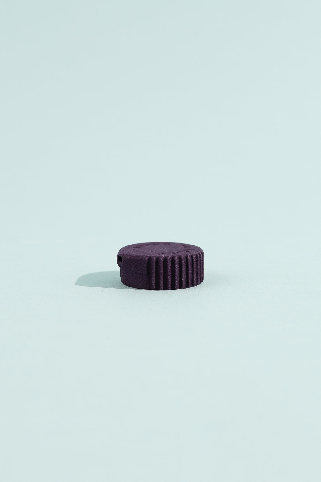Bottle Cap Bidet in amethyst color, designed for use with standard water bottles for hygienic cleaning.