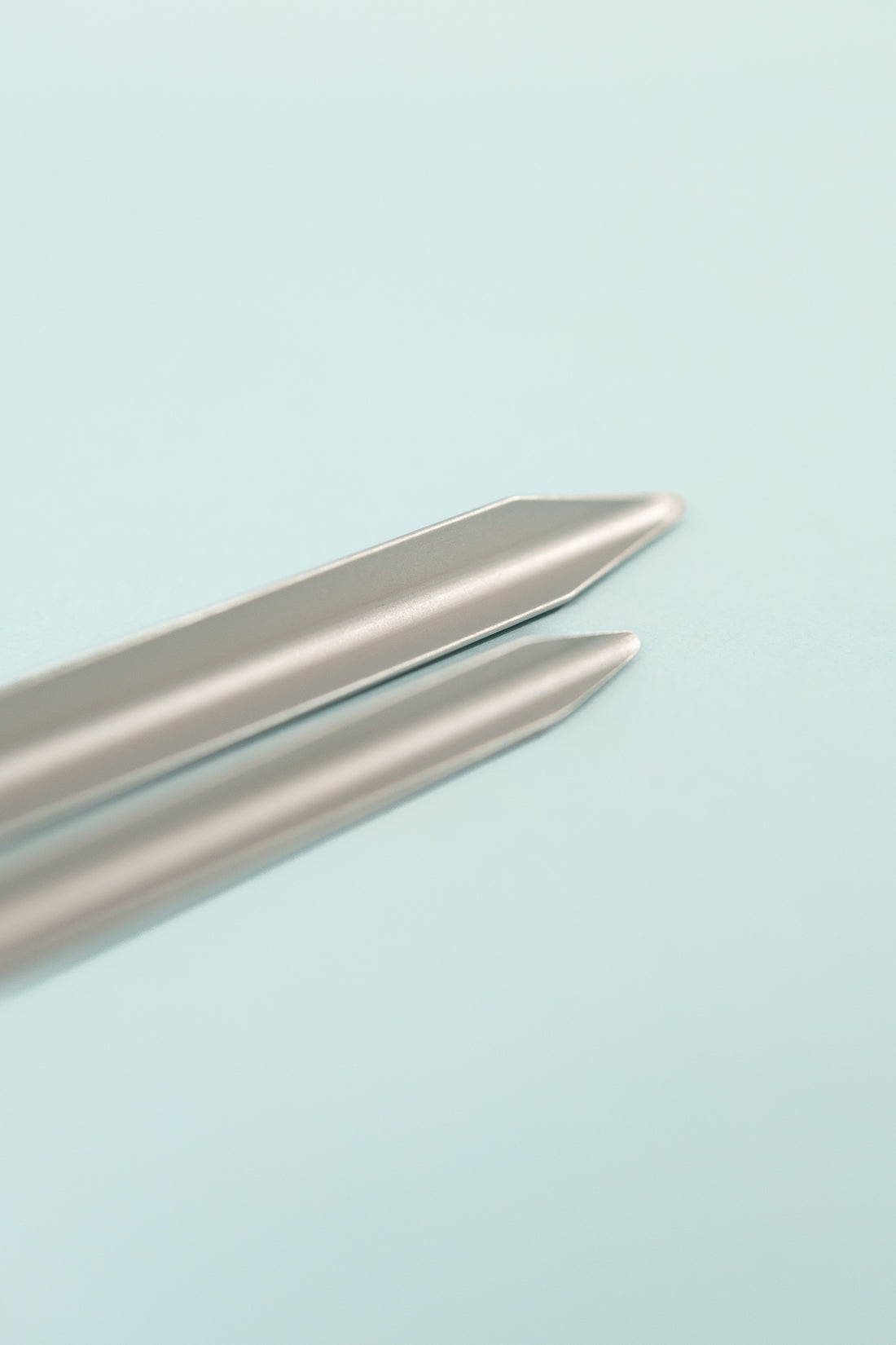 Close-up of DAC Tent Stakes showcasing two aluminum stakes with pointed tips.