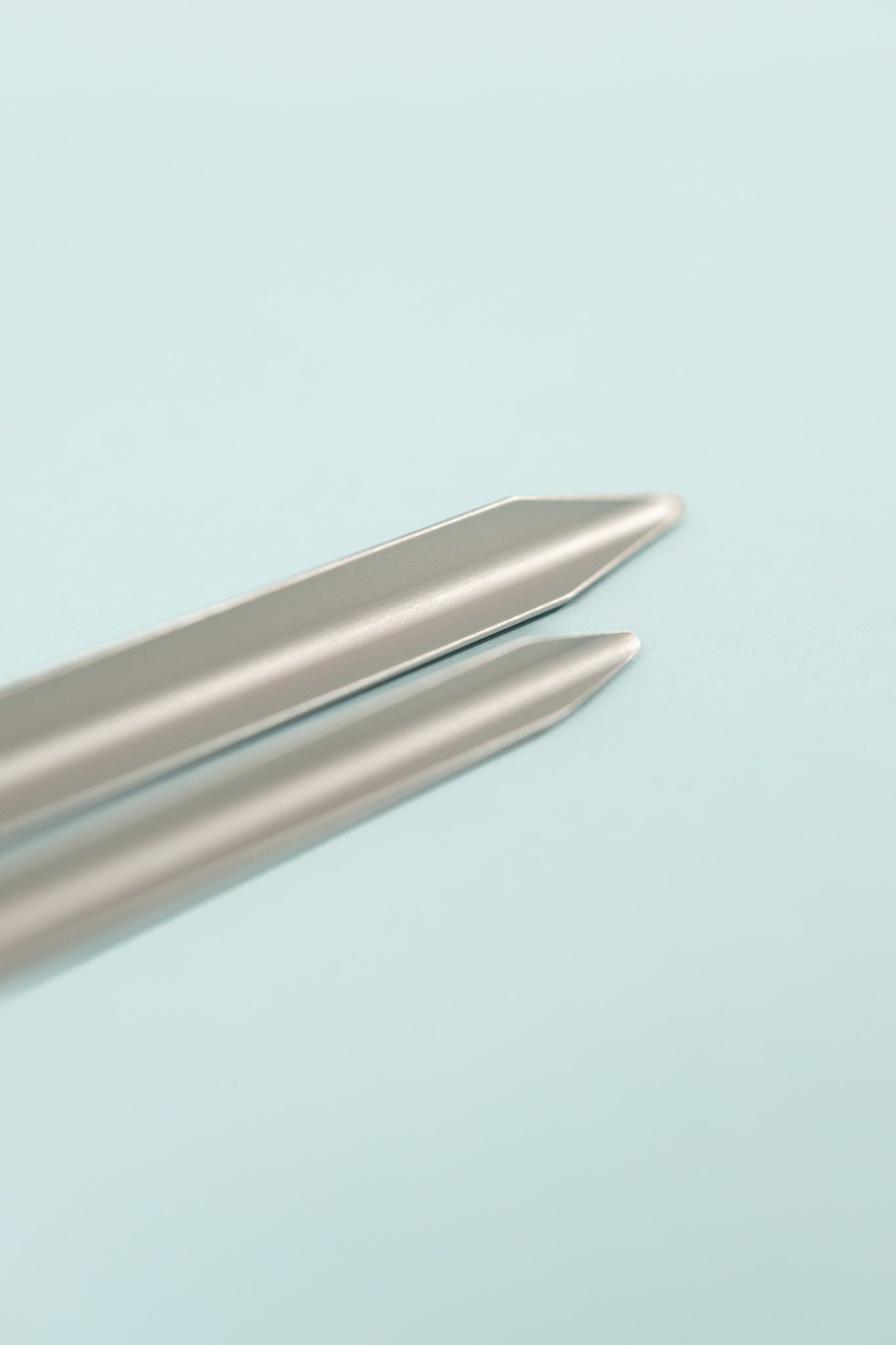 Close-up of DAC Tent Stakes showcasing two aluminum stakes with pointed tips.