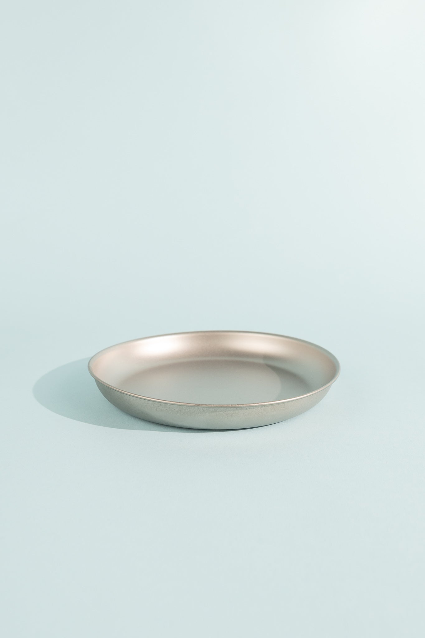 Sleek Titanium Trek Plate on a light background, perfect for outdoor dining and home use.