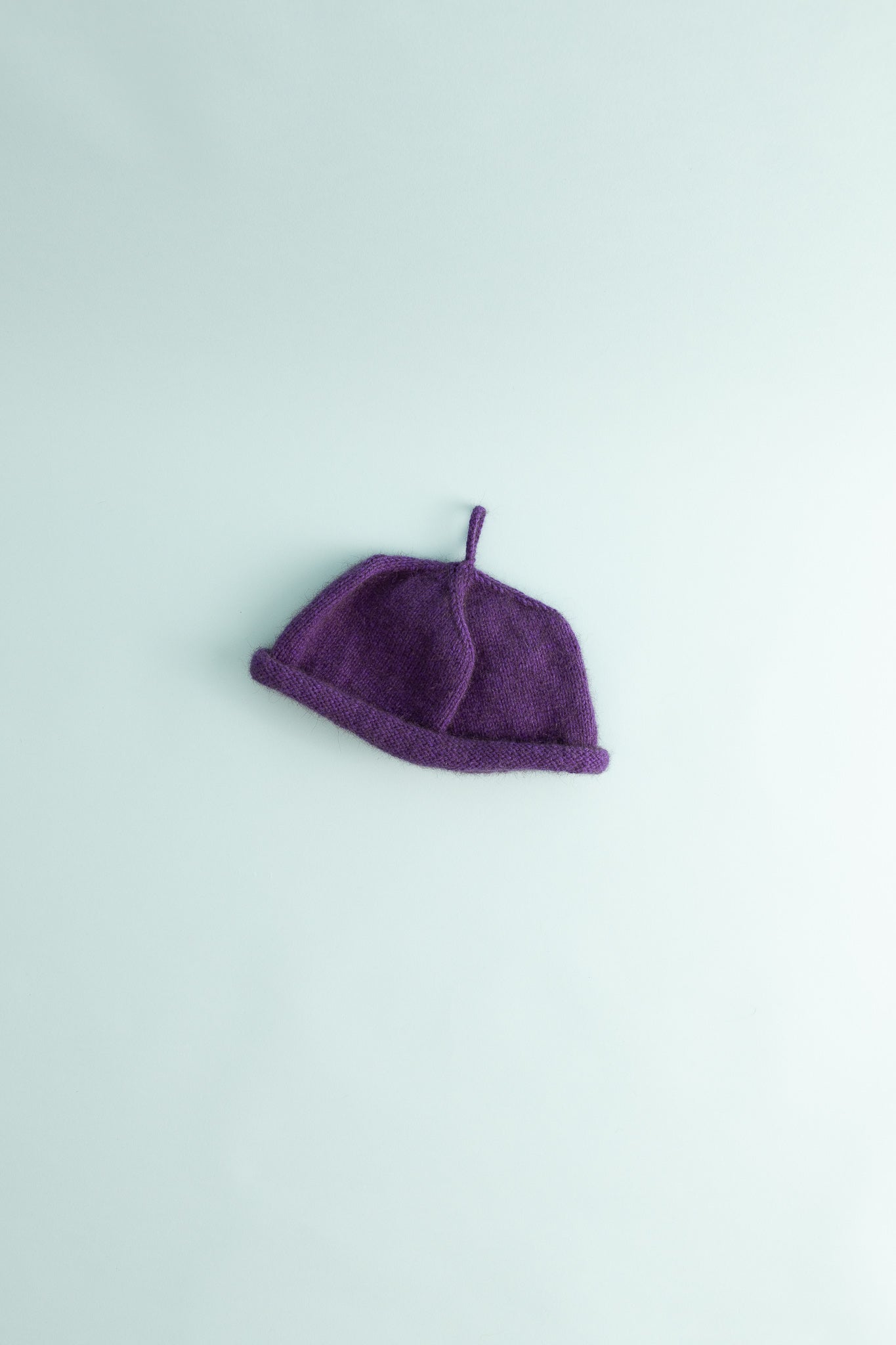 Bonnie Wroe Loop Hat - Purple made of soft possum merino yarn, handknitted and designed for voluminous hair.