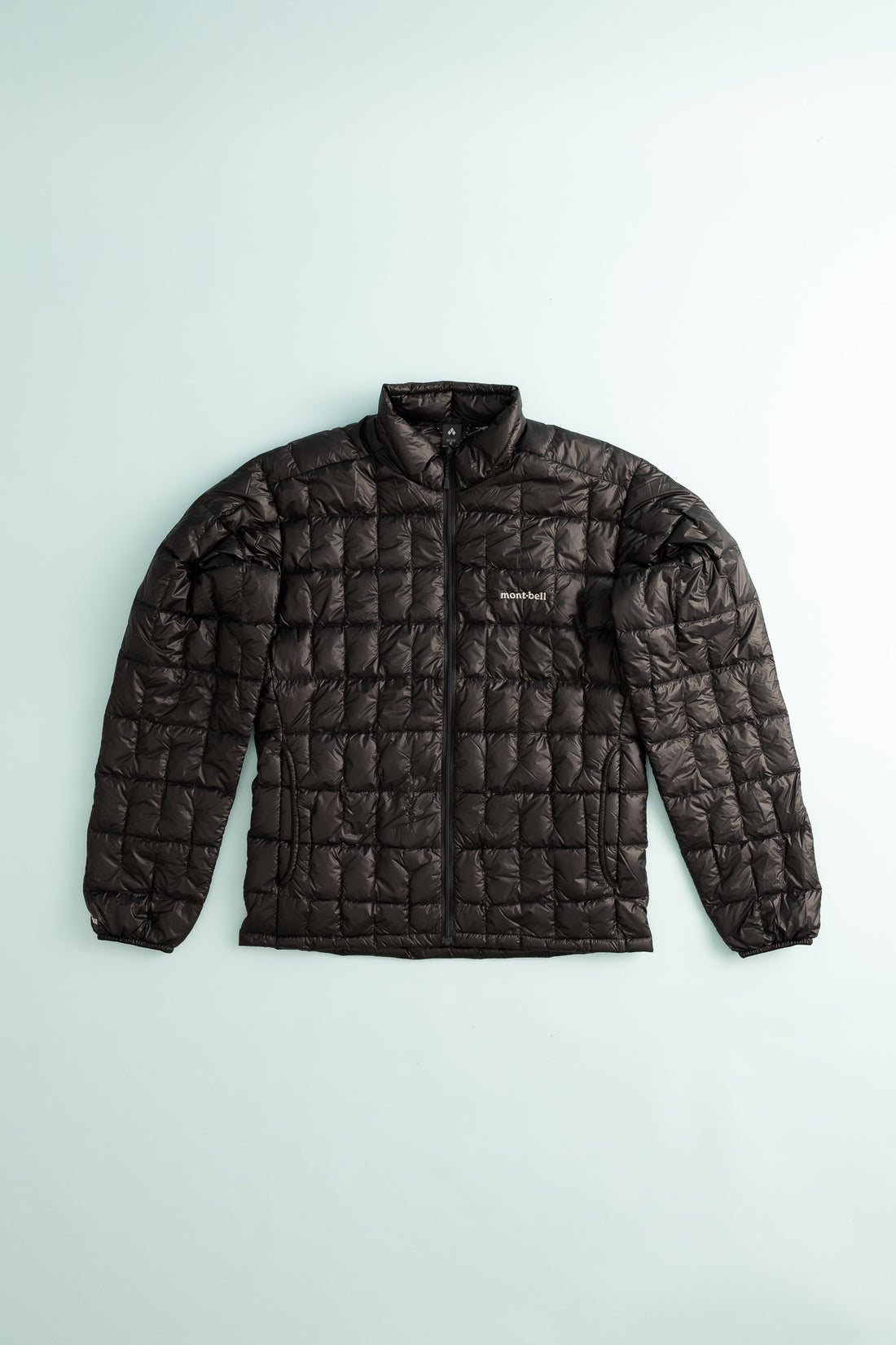 US Men's Plasma 1000 Down Jacket - Black, featuring lightweight down insulation and a quilted design.