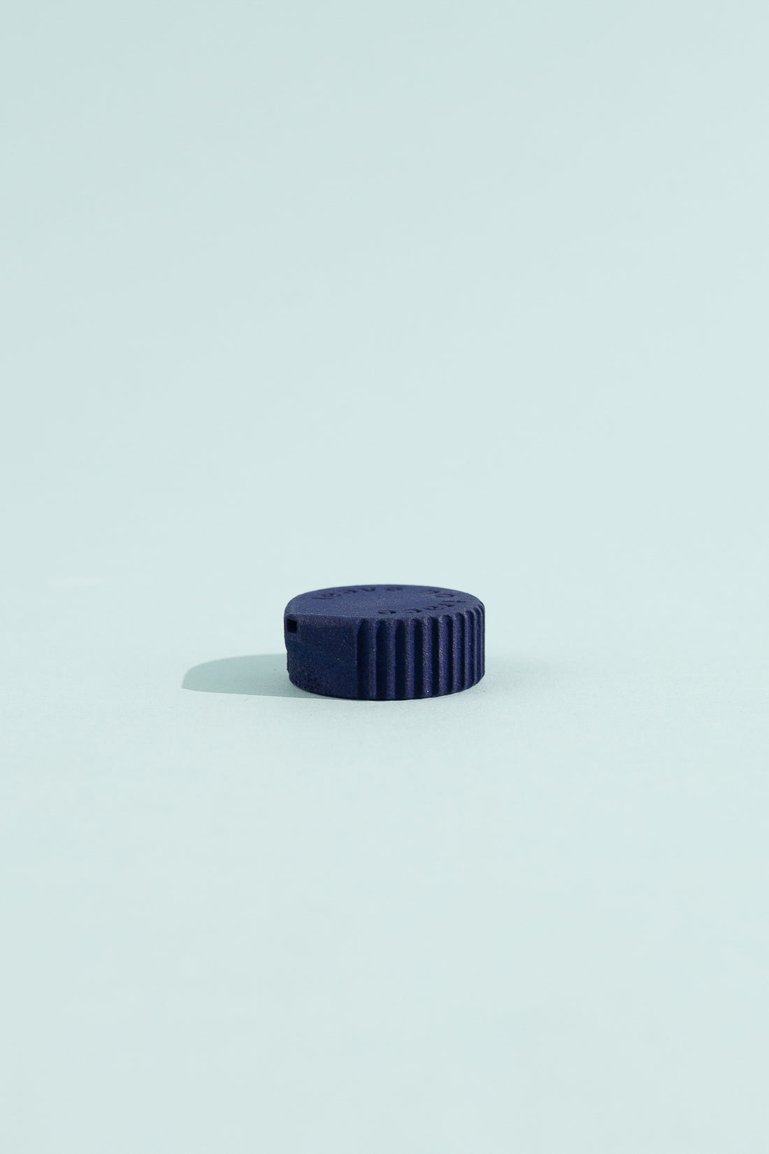 Igneous Gear Bottle Cap Bidet - Azurite on a light blue background, showcasing its compact design for hygiene on the go.