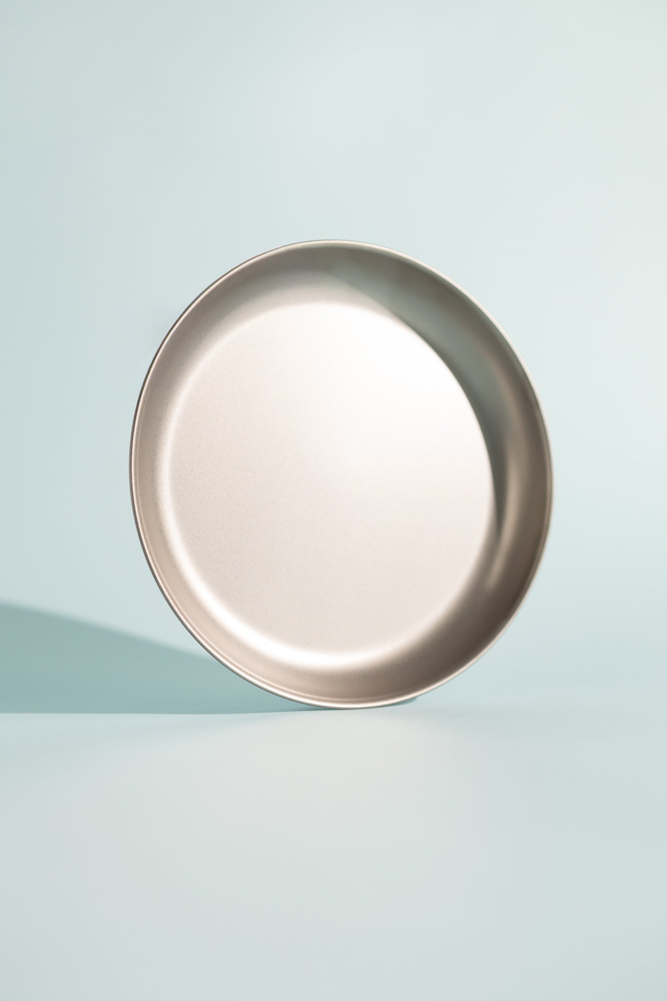 Sleek Titanium Trek Plate on a minimal background, ideal for outdoor dining and home use.