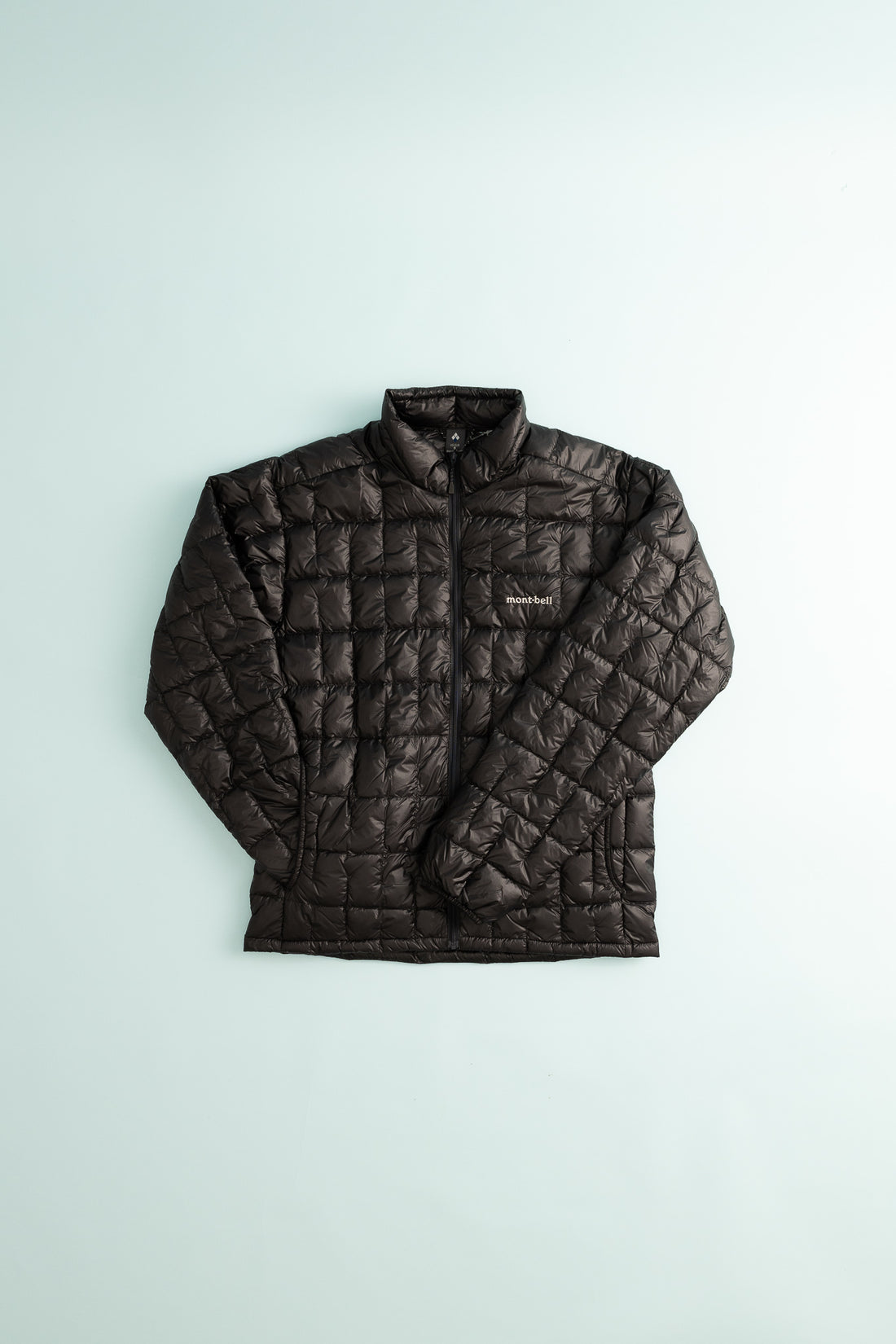 US Men's Plasma 1000 Down Jacket in black featuring a quilted design and zip-up front.