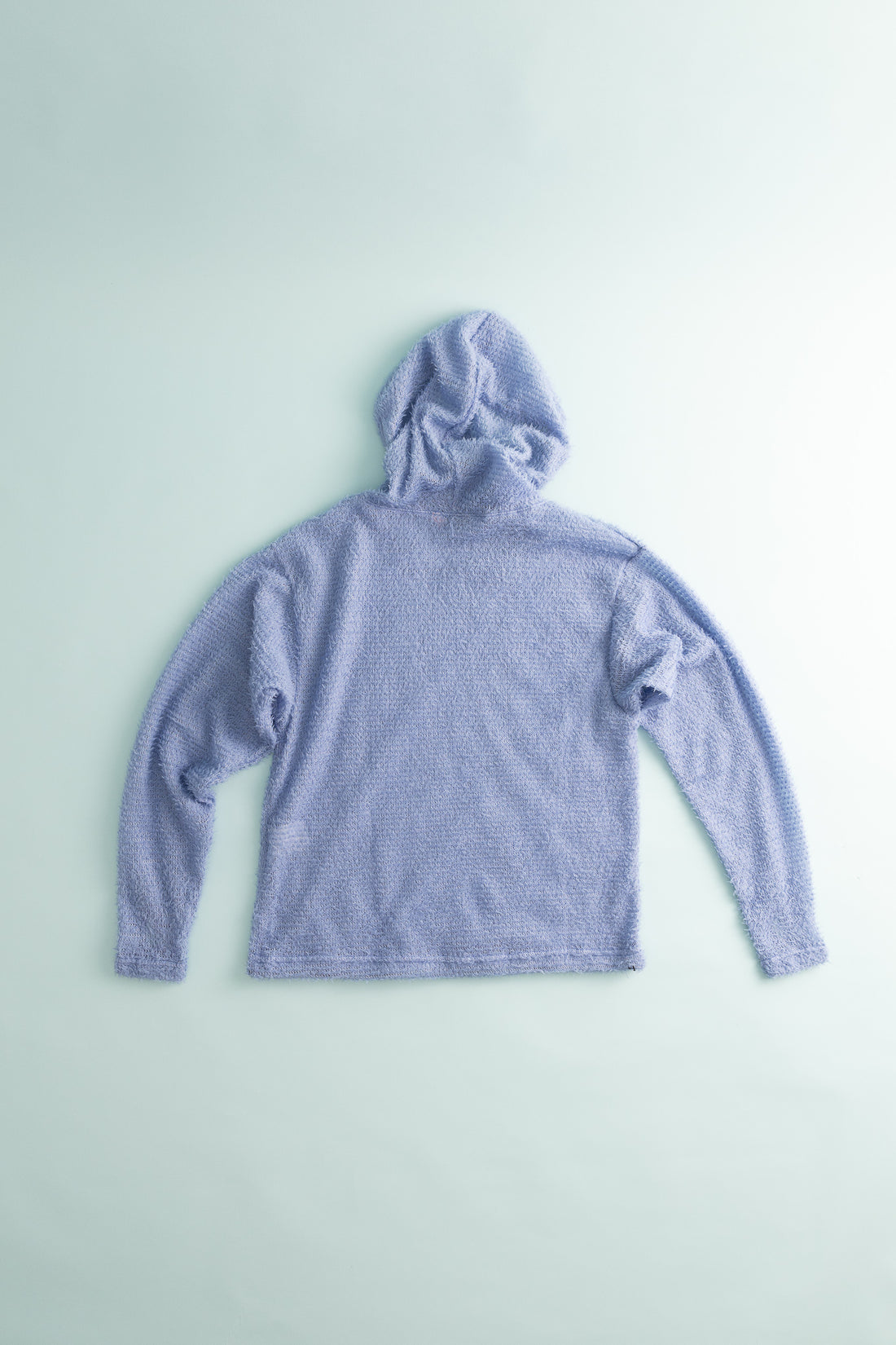 Back view of the Shag Hoodie v2.0 in soft lavender color, showcasing its boxier fit and cozy texture.