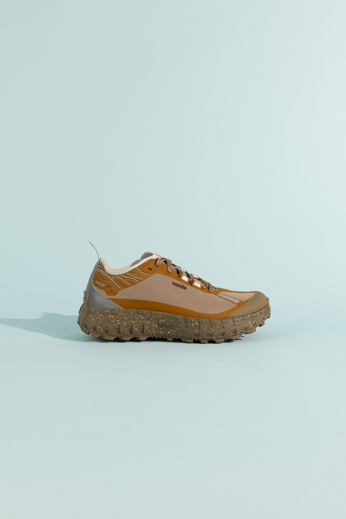 001A - Loam side view of the shoe featuring Arnitel® TPEE® midsole technology and a durable design.
