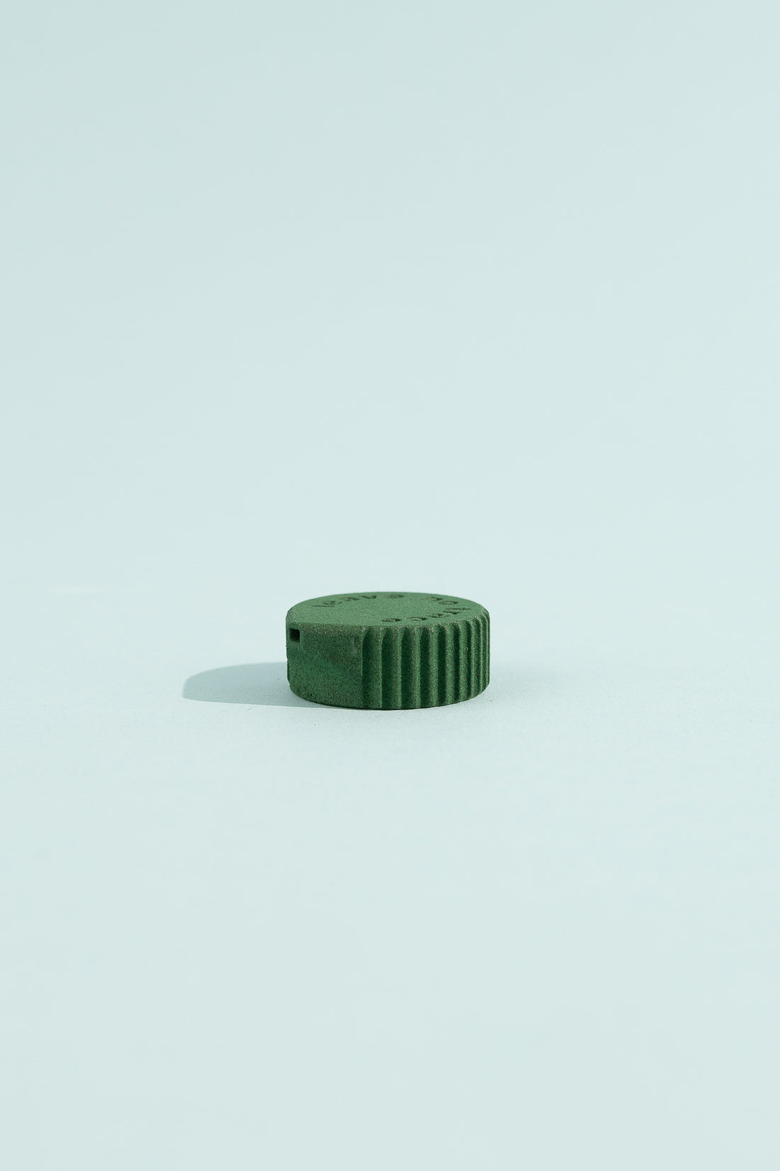 Bottle Cap Bidet - Serpentine on a light background showcasing its compact design.