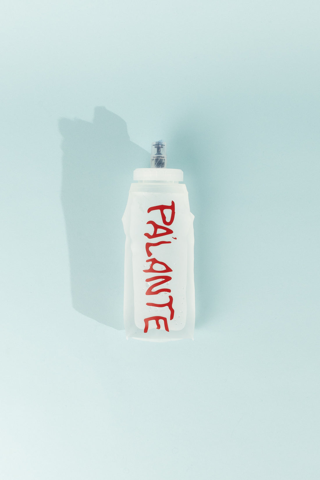 Floppy Water Bottle - Clear with 'PALANTE' written in red, reusable and collapsible, perfect for on-the-go hydration.