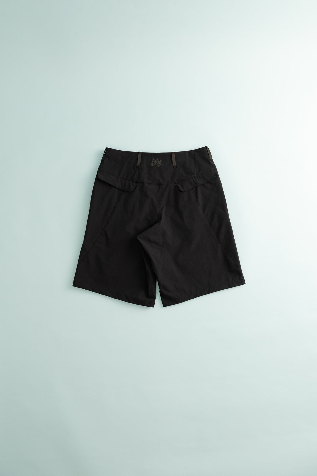 Back view of Traka Softshell Short - Black Beauty for hiking and everyday use.